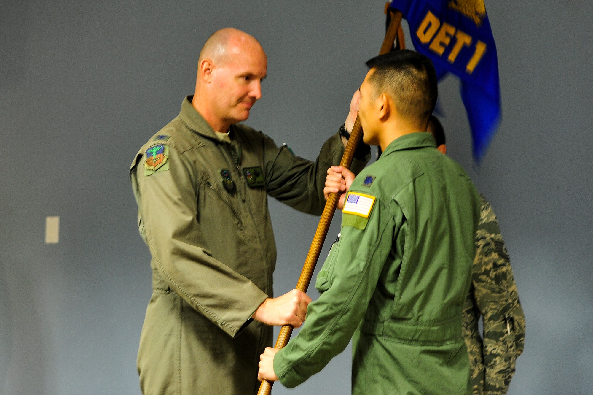 Lt. Col. Samuel Kwan, Detachment 1, 1st Special Operations Group commander, assumes command from Col. Shawn Cameron, 1st SOG commander, during an activation ceremony at the 9th Special Operations Squadron at Hurlburt Field, Fla., Oct. 3, 2014. Det. 1 will facilitate the MC-130P, 9th SOS drawdown and accommodate personnel permanent change of station and permanent change of assignment actions, and eventually retire the MC-130P in May 2015. (U.S. Air Force photo/Airman 1st Class Jeff Parkinson)