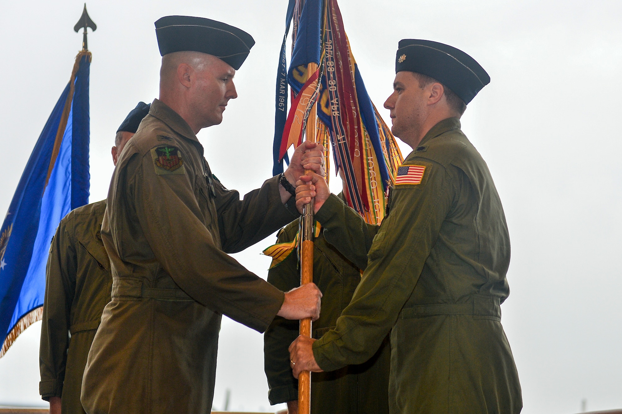 Lt. Col. Douglas Distaso, 1st Special Operations Group deputy commander, relinquishes command to Col. Shawn Cameron, 1st SOG commander, during  the 9th Special Operations Squadron transfer ceremony at the 9th Aircraft Maintenance Unit at Hurlburt Field, Fla., Oct. 3, 2014. The 9th SOS will be relocated to Cannon AFB, NM and operate the new MC-130J Commando II airframe. (U.S. Air Force photo/Airman 1st Class Jeff Parkinson)