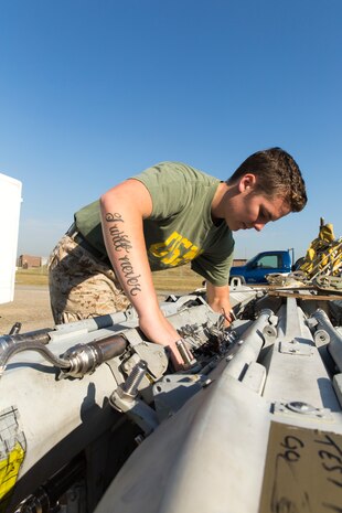 Cpl. Taylor Walter, an ordnanceman with Marine Aviation Logistics Squadron 12, conducts a maintenance check on a BBR-41 Multiple Ejector Rack during the Korean Marine Exchange Program 14-13, Oct. 6, 2014, on Osan Air Force Base, Korea.  Walter is apart of the rack shop, which has special mounting systems that hold each kind of ordnance or equipment in place under the wings or fuselage of an aircraft. The squadron’s participation in KMEP 14-13 will help to increase Marine Aircraft Group 12’s combat readiness, operating skills as a Marine Air-Ground Task Force and enhance joint and combined integration with the United Sates Air Force and Republic of Korea Marine Corps.