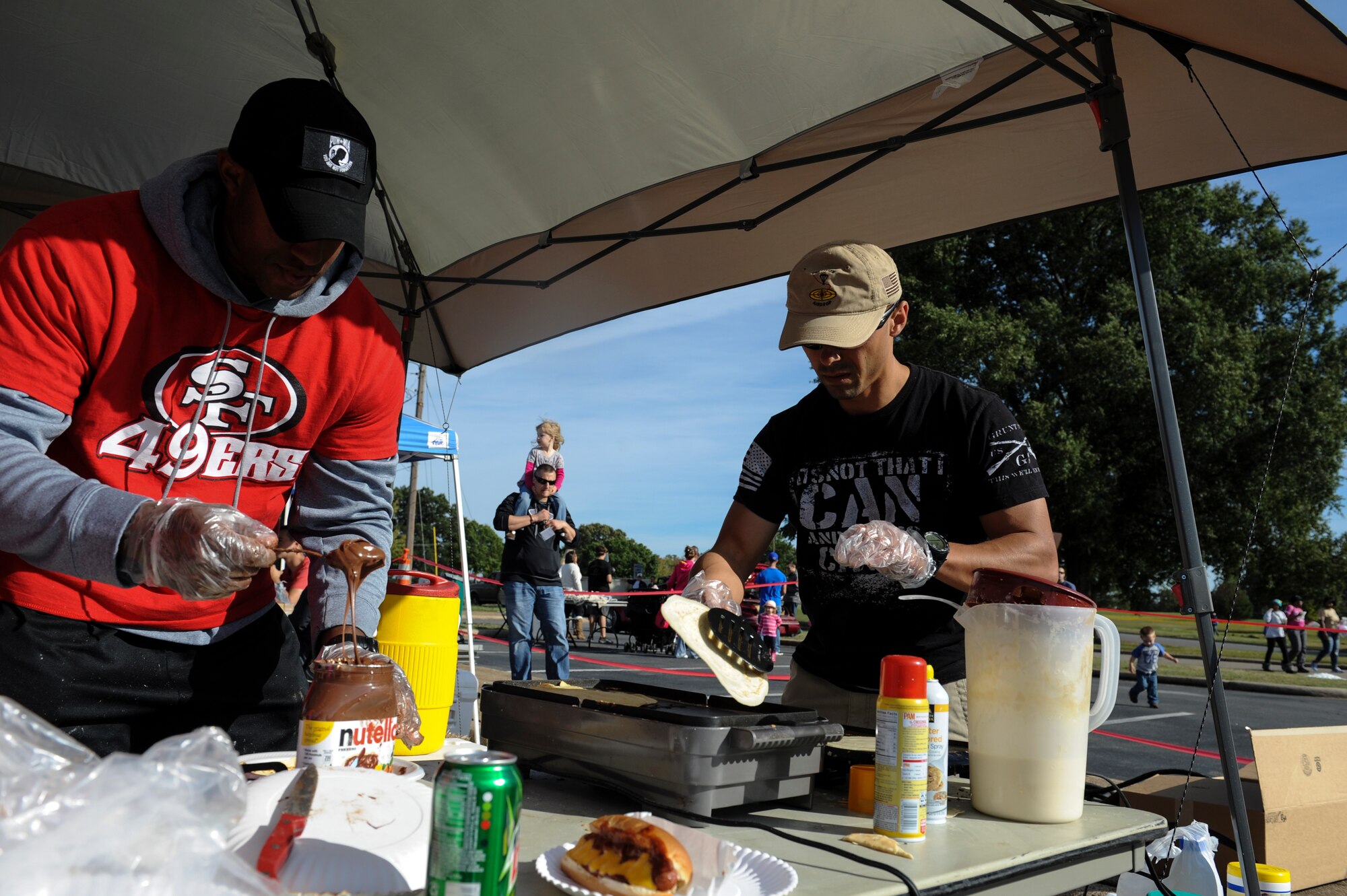 Members of the Air Force Sergeant's Association prepare crepes for hungry Rocktoberfest attendees Oct. 4, 2014, at Little Rock Air Force Base, Ark. The AFSA booth was one of nearly 60 booths that provided entertainment and food during Rocktoberfest. (U.S. Air Force photo by Staff Sgt. Jessica Condit)