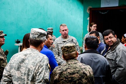 U.S. Army Col. Kirk Dorr, commander of Joint Task Force-Bravo, meets with key civic leaders from La Paz to discuss the needs of the community and tour the Medical Readiness and Training Exercise site in San Marco, La Paz, Honduras, Oct. 8, 2014. The MEDRETE provided the citizens of San Marco an opportunity to receive basic medical care as well as providing the military members with the opportunity to train in a remote location. (U.S. Air Force photo by Tech. Sgt. Heather Redman/Released)