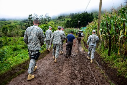 Key leaders from Joint Task Force-Bravo hike to a Medical Readiness and Training Exercise site in San Marco, La Paz, Honduras, Oct. 8, 2014. The MEDRETE provided the citizens of San Marco an opportunity to receive basic medical care as well as providing the military members with the opportunity to train in a remote location. (U.S. Air Force photo by Tech. Sgt. Heather Redman/Released)