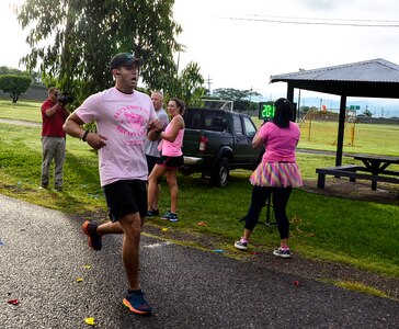 Special Agent Tony Diaz, is the first to finish the “Think Pink 5K” on Soto Cano Air Base, Oct. 9, 2014.   The fun run was planned and coordinated by the Morale, Welfare, and Recreation Center to help increase breast cancer awareness. (U.S. Air Force photo by Tech. Sgt. Heather R. Redman/Released)