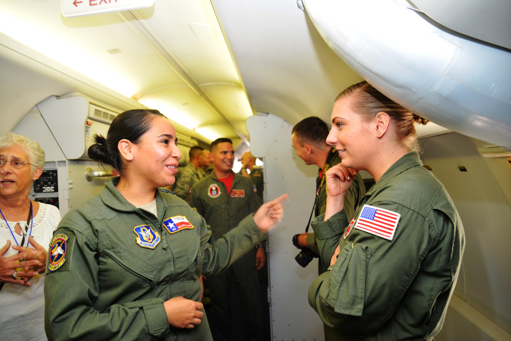 Senior Airman Jaqlynn De La Rosa (left) aboard a Navy P-8A Poseidon talks with Naval Aircrew Operator Calli Carter, “War Eagles” Patrol Squadron Sixteen, Navy Air Station Jacksonville, Florida, 3 Oct. 2014, during a tour of a P-8A at Joint Base San Antonio-Lackland, Texas. The P-8A is a Boeing 737 that has been militarize for maritime patrol and Anti-Submarine Warfare. The 443rd Airlift Wing along with Navy Patrol Squadron, 16 War Eagles gives a joint static tour of their pertinent aircrafts to veteran VP-16 "War Eagles." (U.S. Air Force photo by Minnie Jones)