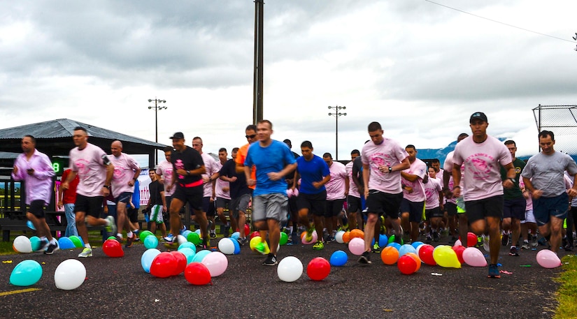 Runners take off through a sea of balloons during the “Think Pink 5K” supporting Breast Cancer Awareness on Soto Cano Air Base, Oct. 9, 2014.   The fun run was planned and coordinated by the Morale, Welfare, and Recreation Center to help increase breast cancer awareness. (U.S. Air Force photo by Tech. Sgt. Heather R. Redman/Released)