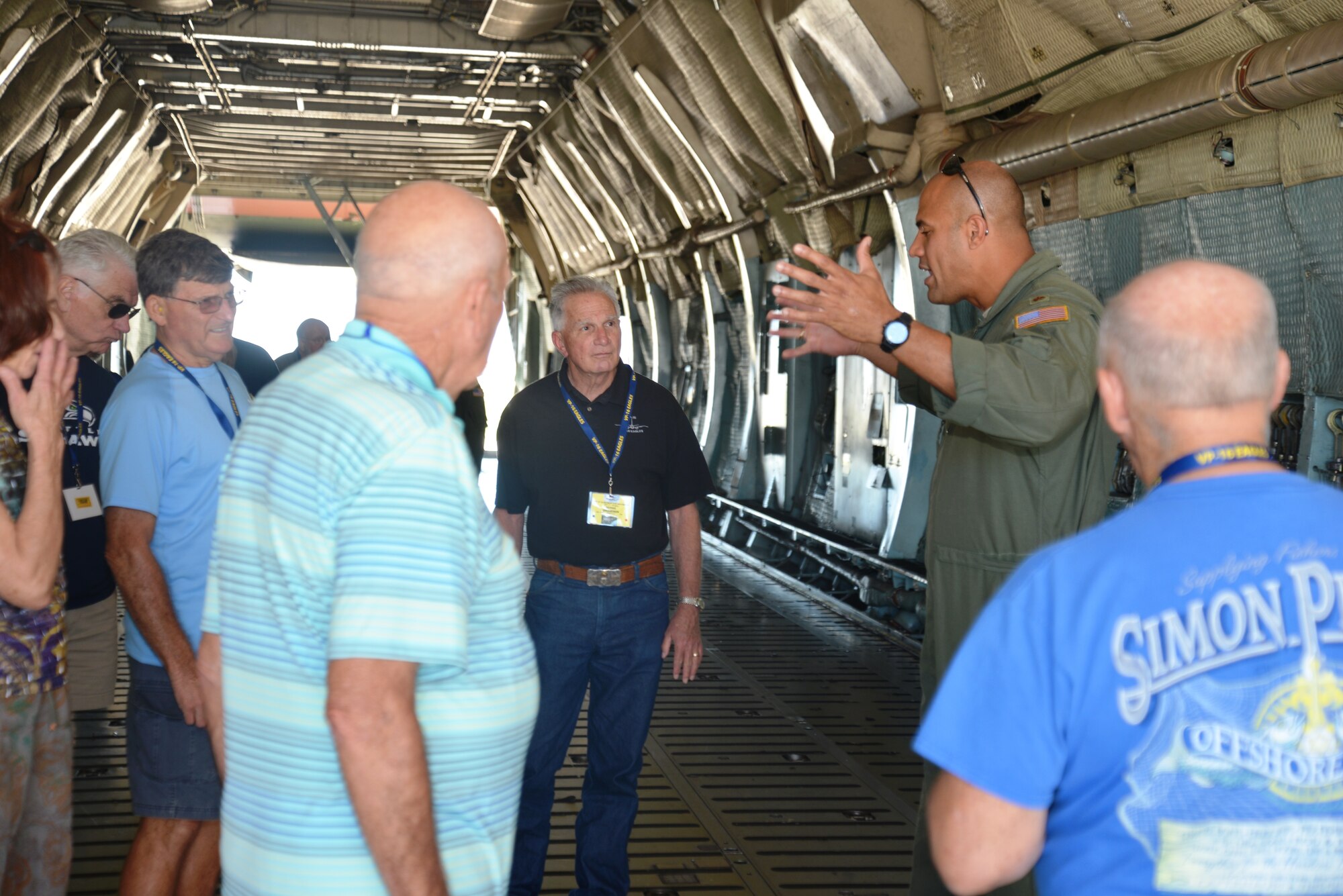 Inside the cargo compartment of a C-5A aircraft, Major Chris Jones, 68th Airlift Squadron, pilot, Joint Base San Antonio-Lackland, Texas, Oct 3, 2014, gives Navy veterans of Patrol Squadron-16 a tour of the Massive C-5. The C-5A Galaxy is one of the largest aircraft in the world, capable of transporting 270,000 pounds. (U.S. Air Force photo by Minnie Jones)

