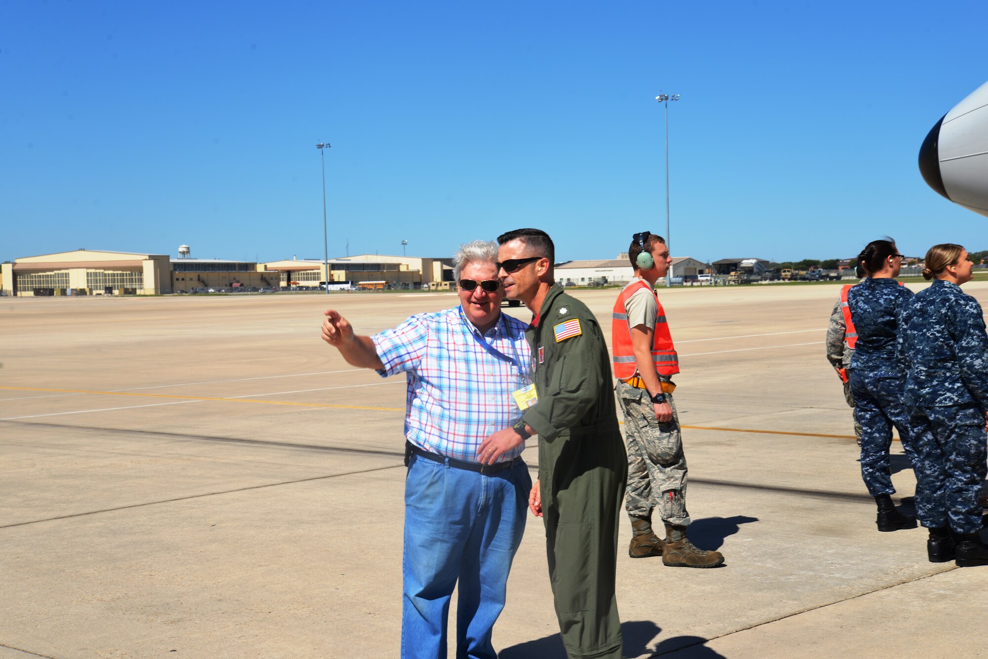 Commander Daniel P. Papp, Patrol Squadron Sixteen, (VP-16) greets one of the VP-16 “War Eagles” veteran after landing at Kelly Field annex, Joint Base San Antonio-Lackland, Texas. The mission of VP-16 "War Eagles" is to operate Maritime patrol aircraft, such as the P-8A Poseidon in support of national interests. The P-8A is a militarized Boeing 737, used for maritime patrol and Anti-Submarine Warfare.  (U.S. Air Force photo by Minnie Jones)

