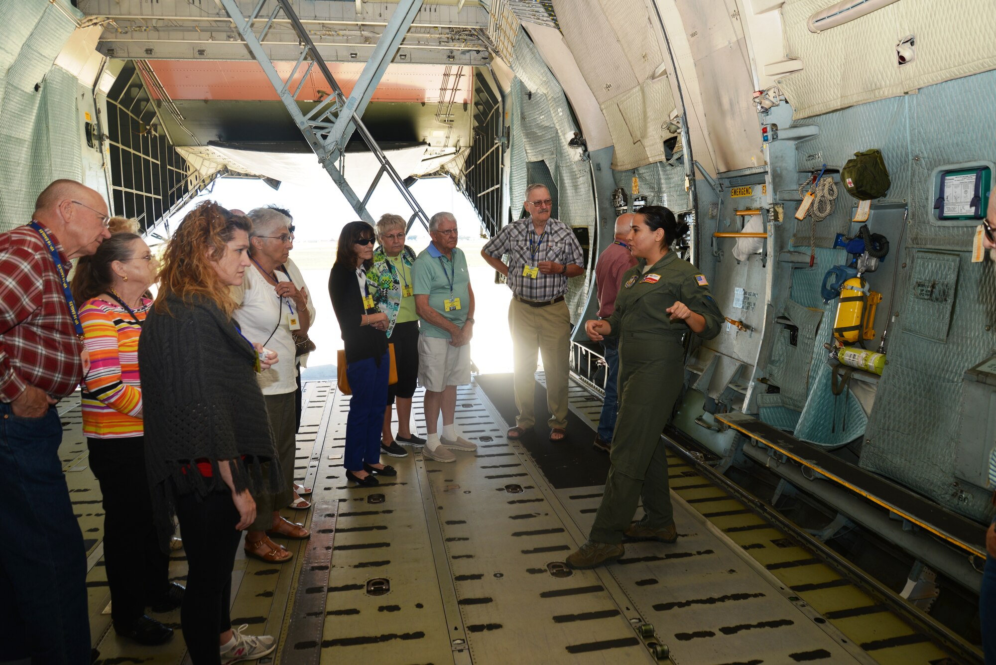 Loadmaster, SrA Jaqlynn De La Rosa, 68th Airlift Squadron, Joint Base San Antonio-Lackland explains cargo aircraft load planning, Oct. 3, 2014 to VP-16 “War Eagles” Navy veterans on board a C-5A Galaxy. The C-5A Galaxy is one of the largest aircraft in the world, capable of transporting 270,000 pounds. (U.S. Air Force photo by Minnie Jones)