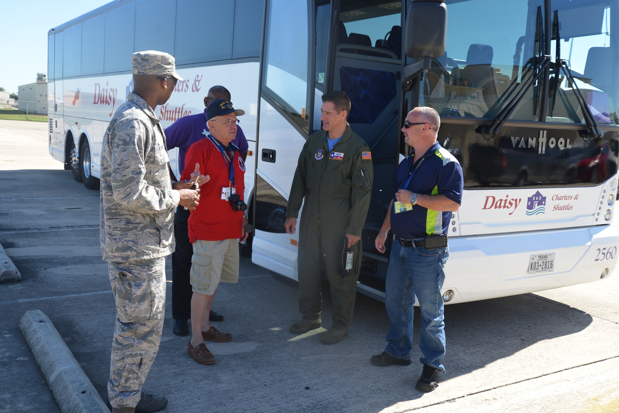 Col. William Whittenberger, 433rd Airlift Wing, commander, greets Bill Sherman, president of the Patrol Squadron Sixteen, Reunion Association, Inc., and Navy veterans of VP-16, known as “War Eagles” just prior to their visit to the flightline to tour a C-5A Galaxy. (U.S. Air Force photo by Minnie Jones)