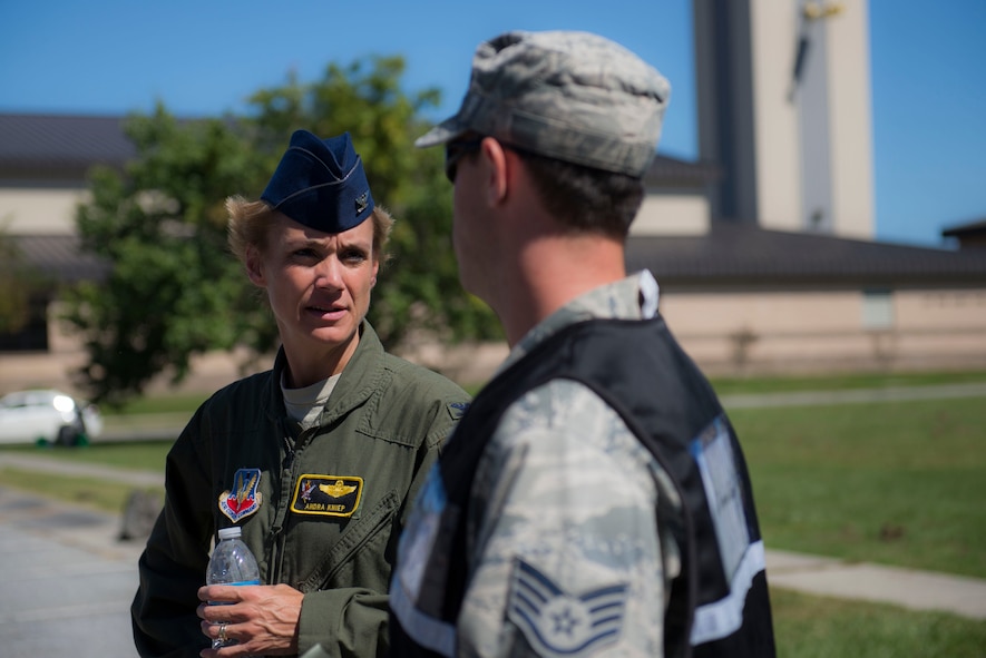 U.S. Air Force Col. Andra Kniep, 23d Wing vice commander, speaks to a 23d Logistics Readiness Squadron NCO about pallet-packing procedures during a Wing Readiness Inspection Oct. 6, 2014, at Moody Air Force Base, Ga. Moody processed more than 800 Airmen and 583 tons of cargo for a simulated deployment to Avon Park Air Force Range, Fla. (U.S. Air Force photo by Airman 1st Class Dillian Bamman/Released)