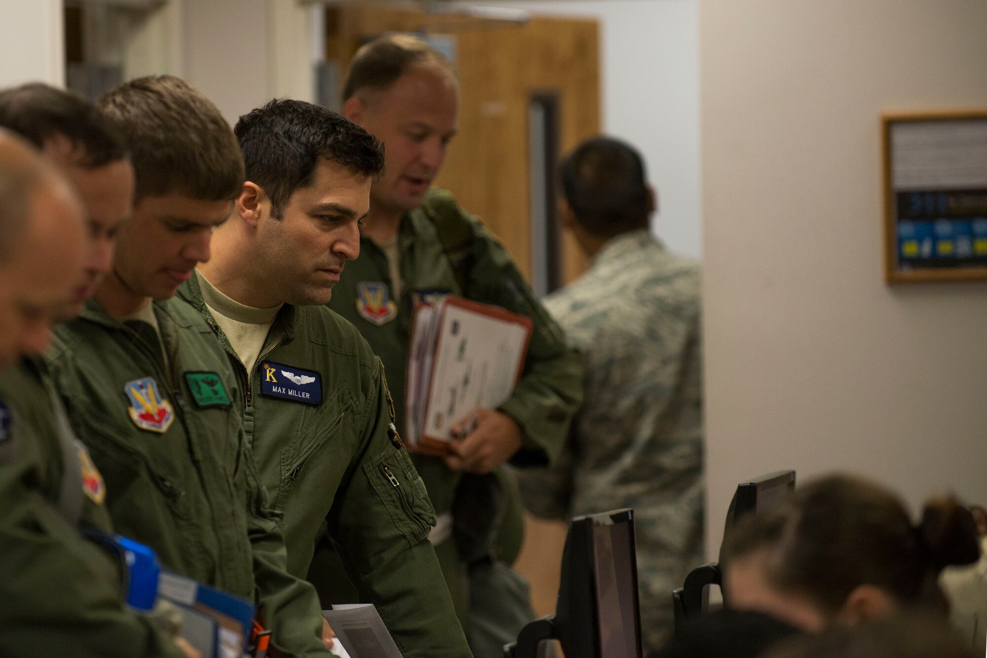 U.S. Air Force Capt. Max Miller, 71st Rescue Squadron, processes a simulated deployment line during a Wing Readiness Inspection Oct. 6, 2014, at Moody Air Force Base, Ga. The exercise focused on identifying Moody’s readiness and capability to deploy Airmen on short notice.
(U.S. Air Force photo by Airman 1st Class Dillian Bamman/Released)
