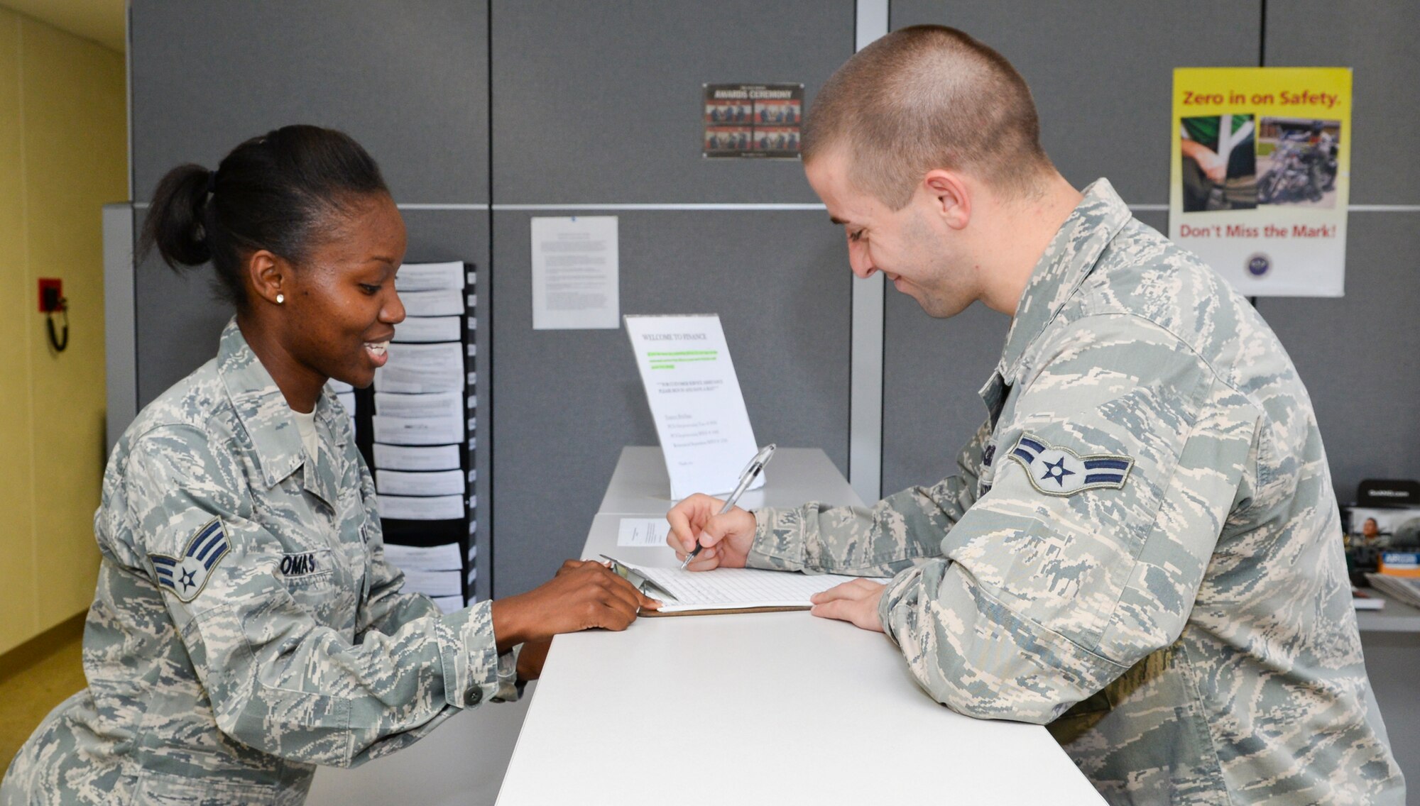 Senior Airman Shakeeta Thomas, 2nd Comptroller Squadron customer service technician, answers finance questions for a customer on Barksdale Air Force Base, La., Oct. 6, 2014. 2nd CPTS Airmen provide one-on-one service where customers can receive answers to their questions about pay issues. (U.S. Air Force photo/Senior Airman Benjamin Raughton)