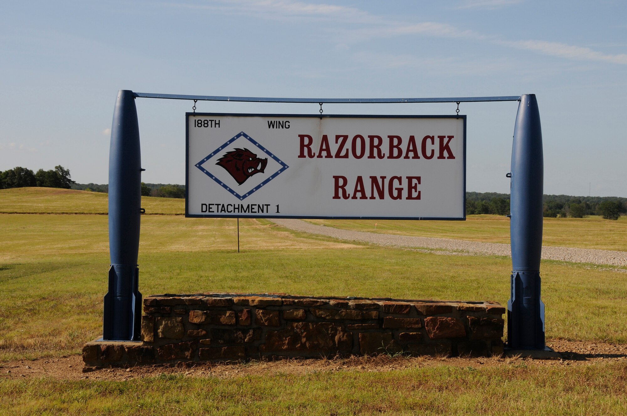 Pictured is the signage at 188th Wing Detachment 1 Razorback Range at Fort Chaffee Maneuver Training Center, Arkansas. The range is maintained by the 188th and provides varying types of training to military units from around the world. That includes close-air support training with joint terminal attack controllers. Razorback Range celebrates 40 years of operation in 2014. (U.S. Air National Guard photo illustration/Released).