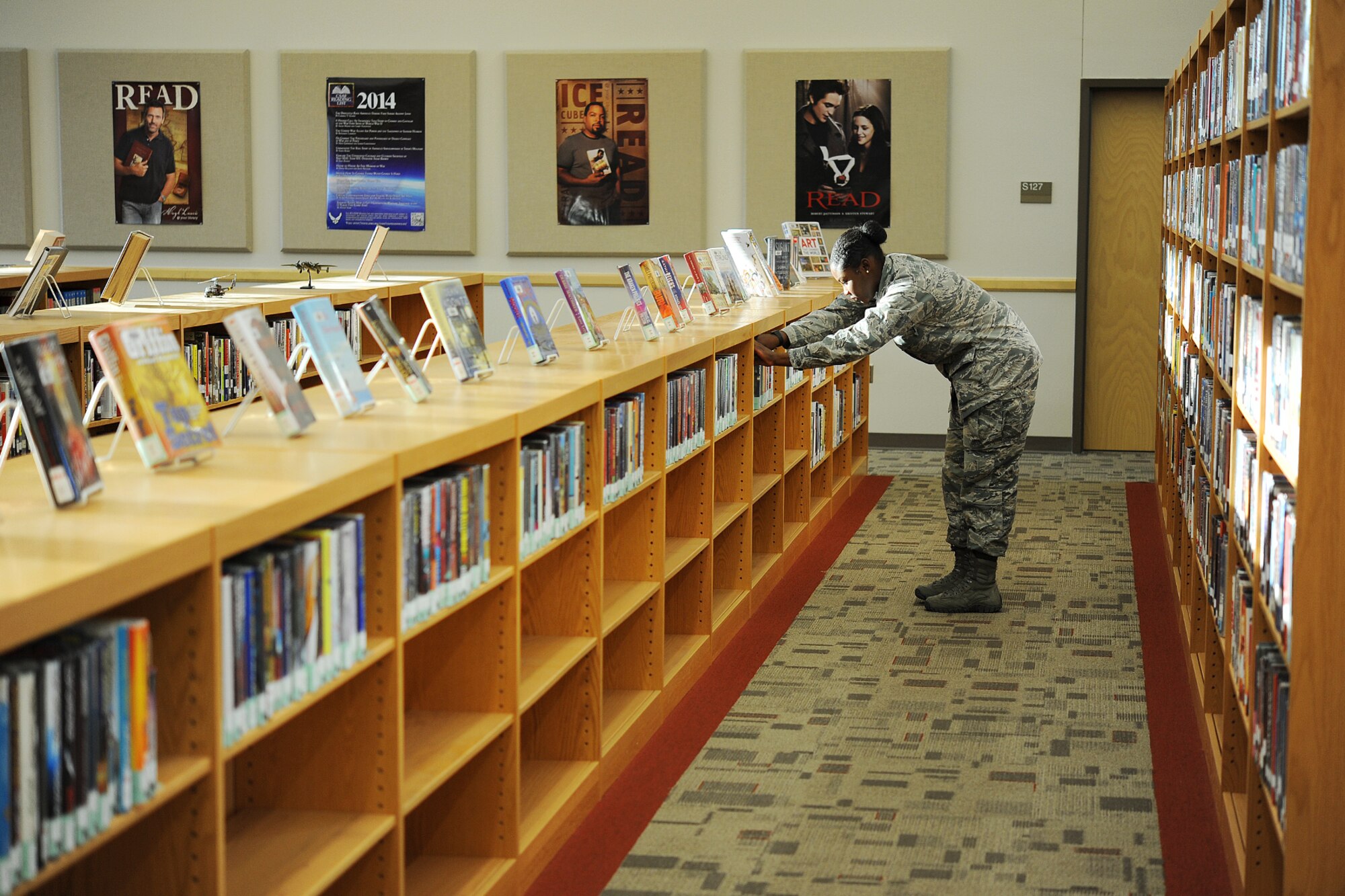 GOODFELLOW AIR FORCE BASE, Texas – Airman Jesyka Ware, 315th Training Squadron student, browses through a bookshelf at the base library Sept. 30. After school, Ware sometimes goes to the library to enjoy a quiet environment to decompress from her classes. (U.S. Air Force photo/ Airman 1st Class Devin Boyer)
