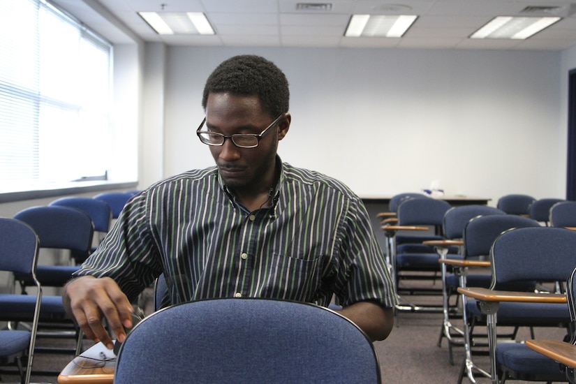 Shaquan Bagby, a Philadelphia, Pa., native looking to join the Army Reserves, prepares for an interview between evaluation stages while at the Military Entrance Processing Station on Joint Base McGuire-Dix-Lakehurst, N.J., Oct. 7, 2014. (U.S. Army photo by Sgt. Richard W. Hoppe/Released)