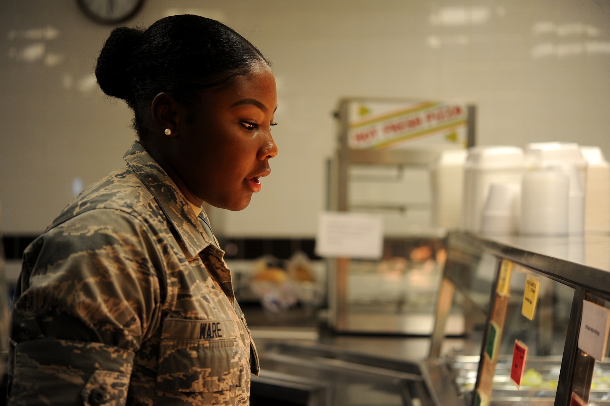 GOODFELLOW AIR FORCE BASE, Texas – Airman Jesyka Ware, 315th Training Squadron student, asks for food during breakfast at the Cressman Dining Hall Sept. 17. After breakfast, Ware and the other students form up outside the dining facility before marching to class. (U.S. Air Force photo/ Airman 1st Class Devin Boyer)
