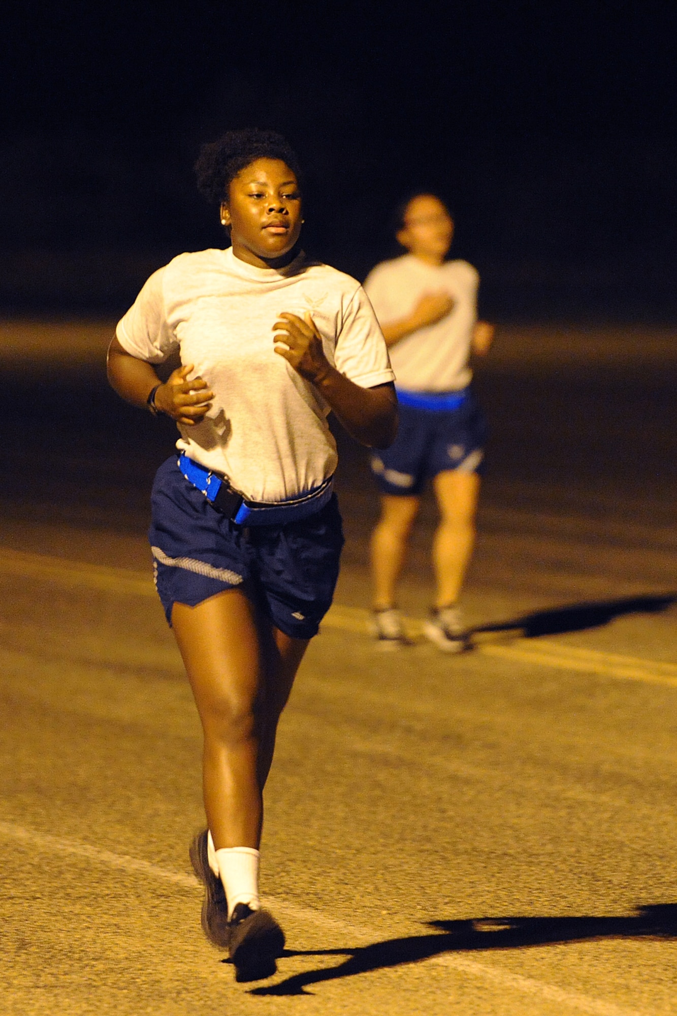 GOODFELLOW AIR FORCE BASE, Texas – Airman Jesyka Ware, 315th Training Squadron student, runs down the flight line during a morning physical training session Sept. 17. Ware is training at the 315th TRS to become a geospatial intelligence analyst. (U.S. Air Force photo/ Airman 1st Class Devin Boyer)