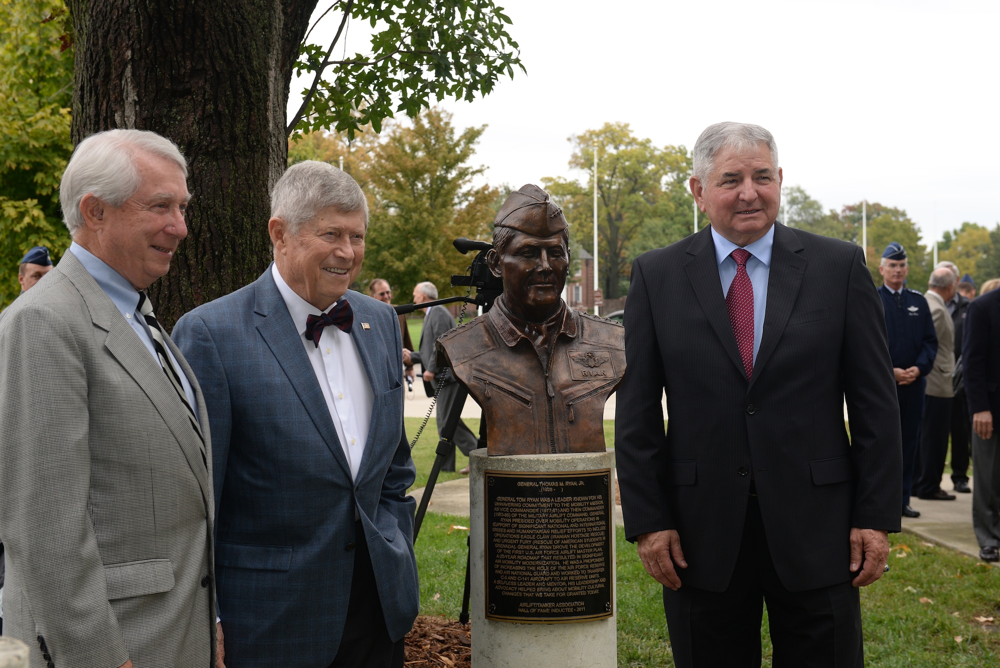 Retired Gen. Duane H. Cassidy, U.S. Transportation Command commander and Military Airlift Command commander, and retired Gen. Thomas H. Ryan, MAC commander, stand next to the bust of Ryan with Gen. Ronald R. Fogleman, following Fogleman's induction to the Airlift/Tanker Association Hall of Fame Oct. 9, 2014, at Scott Air Force Base, Illinois. Past and present mobility leaders attended the ceremony. (U.S. Air Force photo by Airman 1st Class Erica Crossen)