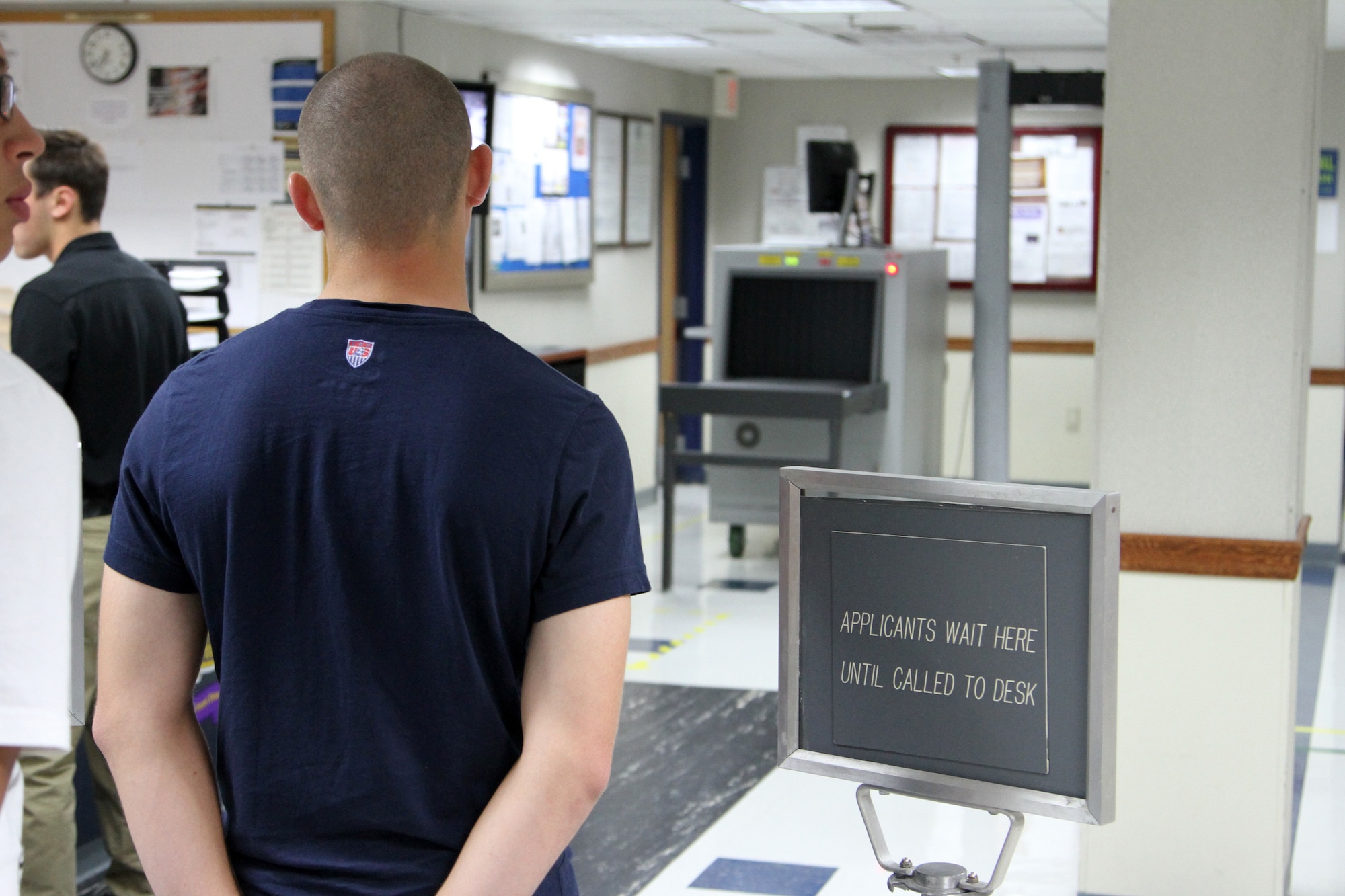 Applicants wait to be called to the central command desk in order to get there identification confirmed and pictures taken while at the Military Entrance Processing Station on Joint Base McGuire-Dix-Lakehurst, N.J., Oct. 7, 2014. (U.S. Army photo by Sgt. Richard W. Hoppe/Released)