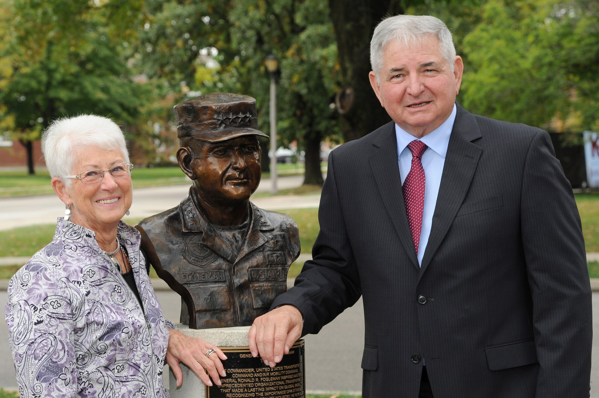 Former Air Force Chief of Staff Gen. Ronald R. Fogleman and his wife, Miss Jane, view Fogleman's bust, the 23rd inductee into the Airlift/Tanker Association's Hall of Fame during a bronze bust dedication Oct. 9, 2014, at Scott Air Force Base, Illinois. Fogleman served as the Air Force Chief of Staff, U.S. Transportation Command, and Commander, Air Mobility Command, when it was a dual-hatted position. Fogleman also flew 315 combat missions and acquired more than 800 combat hours as an F-100 Forward Air Controller and F-4E pilot. His was recognized with the award of the Silver Star, two Distinguished Flying Crosses and received the Purple Heart for injuries he received while ejecting from his crippled aircraft.  (U.S. Air Force photo/Senior Airman Tristin English)