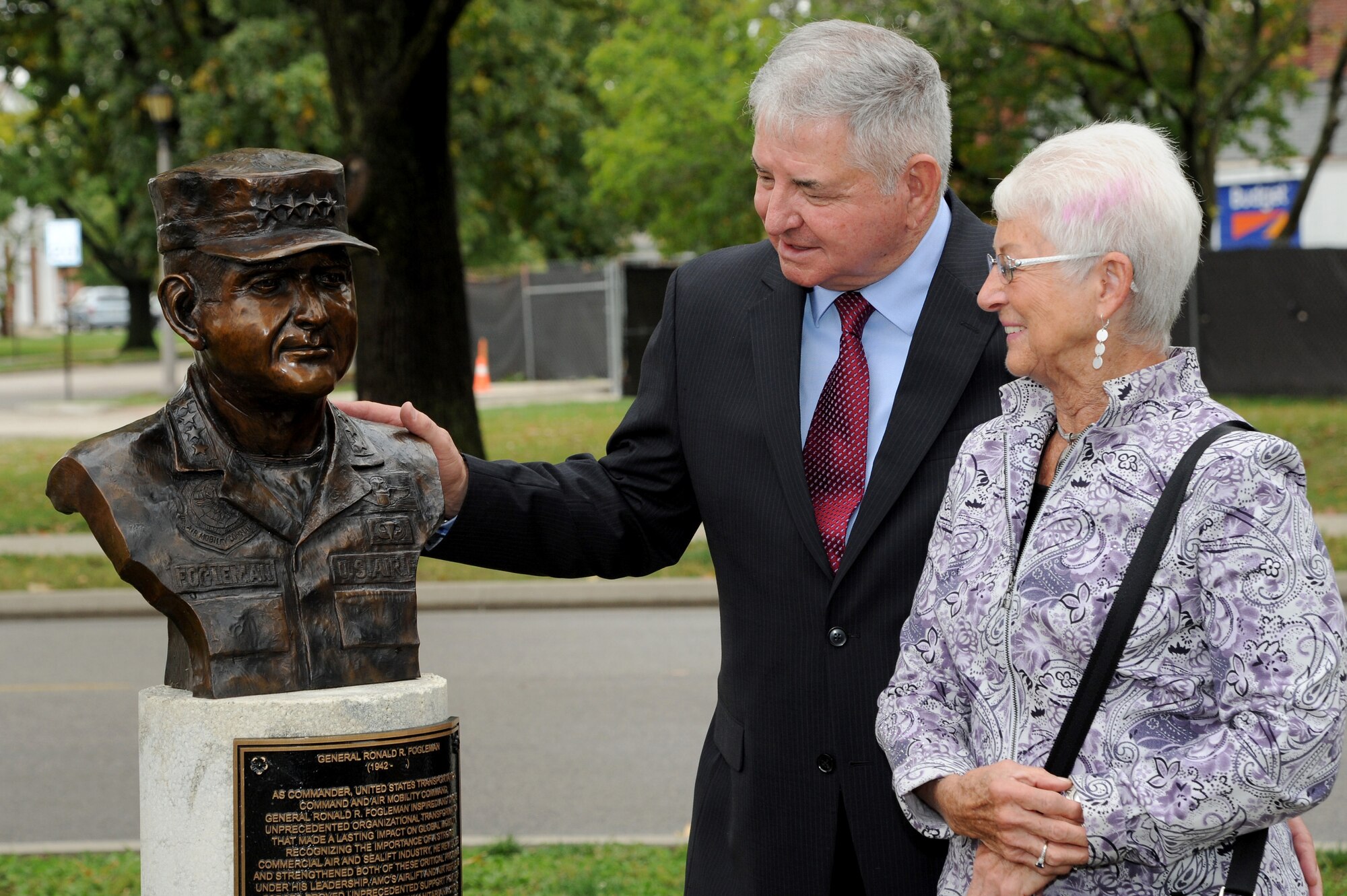 Former Air Force Chief of Staff Gen. Ronald R. Fogleman and his wife, Miss Jane, view the newly unveiled inductee into the Airlift/Tanker Association's Hall of Fame during a bronze bust dedication Oct. 9, 2014, at Scott Air Force Base, Illinois. Fogleman served as the Air Force Chief of Staff, U.S. Transportation Command, and Commander, Air Mobility Command, when it was a dual-hatted position. Fogleman also flew 315 combat missions and acquired more than 800 combat hours as an F-100 Forward Air Controller and F-4E pilot. His was recognized with the award of the Silver Star, two Distinguished Flying Crosses and received the Purple Heart for injuries he received while ejecting from his crippled aircraft.  (U.S. Air Force photo/Senior Airman Tristin English)