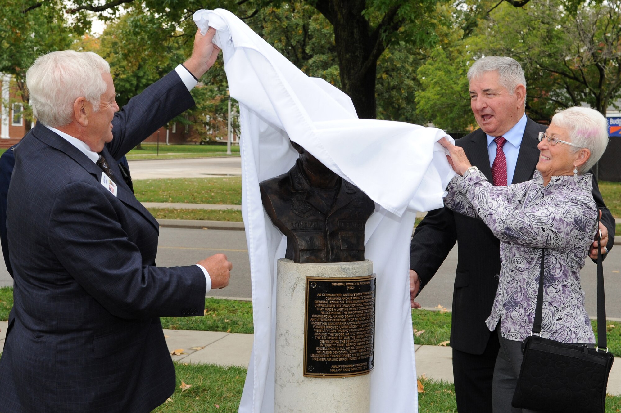 Retired Gen. Arthur Lichte, former Air Mobility Command commander and Airlift/Tanker Association chairman, former Air Force Chief of Staff Gen. Ronald R. Fogleman, Miss Jane unveil Fogleman's bust  inducting him into the Airlift/Tanker Association's Hall of Fame Oct. 9, 2014 at Scott Air Force Base, Illinois. Fogleman served as the Air Force Chief of Staff, U.S. Transportation Command, and Commander, Air Mobility Command, when it was a dual-hatted position. Fogleman also served as a fighter pilot, training instructor, professor, Air Mobility Command and U.S. Transportation Command commander, and the Air Force Chief of Staff before retiring after a 34-year career in 1997. (U.S. Air Force photo/Senior Airman Tristin English)