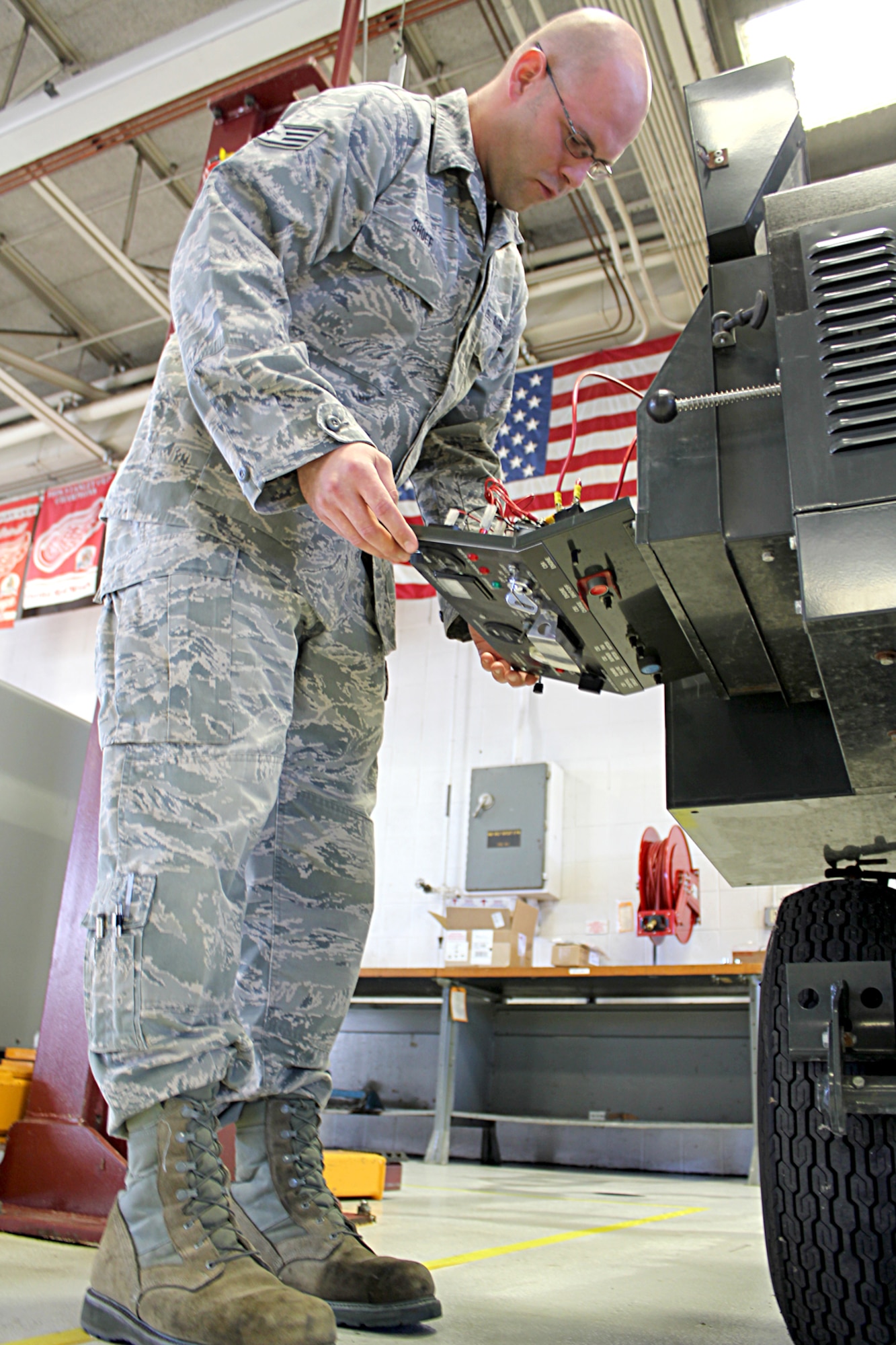 Staff Sgt. Michael Shoff works in the aerospace ground equipment shop -- known as "AGE" -- for the 191st Maintenance Squadron at Selfridge Air National Guard Base, Mich., Oct. 9, 2014. AGE specialists needs to be well-rounded mechanics as they maintain, repair and troubleshoot about two dozen different types of equipment used to support aircraft operations, including electronics, pneumatics, power generation, heating & cooling and more. The 191st MXS supports KC-135 Stratotanker operations at Selfridge. (U.S. Air National Guard photo by Tech. Sgt. Dan Heaton)