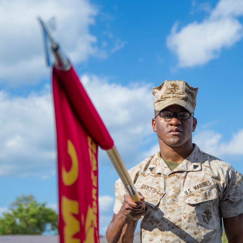 Cpl. Ryan Barclift, Marine Transport Squadron Andrews aviation operations NCO in-charge, “presents arms” during sword and guidon training at Joint Base Andrews, Md., Oct. 8, 2014. The training is part of the first joint Corporals Course here. It is designed to provide students with the knowledge and skills necessary to be successful small-unit leaders. (U.S. Air Force photo/Airman 1st Class Ryan J. Sonnier)