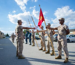 Sgt. Jerald Scandrett, Marine Transport Squadron Andrews’ administration chief, instructs students on the proper movements of a guidon during sword and guidon training at Joint Base Andrews, Md., Oct. 9, 2014. The students are from three different units; MTSA, Marine Aerial Refueler Transport Squadron 452, and the Fleet Logistics Support Squadron 1. The training is part of the first joint Corporals Course here. It is designed to provide students with the knowledge and skills necessary to be successful small-unit leaders. (U.S. Air Force photo/Airman 1st Class Ryan J. Sonnier)