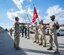 Sgt. Jerald Scandrett, Marine Transport Squadron Andrews’ administration chief, instructs students on the proper movements of a guidon during sword and guidon training at Joint Base Andrews, Md., Oct. 9, 2014. The students are from three different units; MTSA, Marine Aerial Refueler Transport Squadron 452, and the Fleet Logistics Support Squadron 1. The training is part of the first joint Corporals Course here. It is designed to provide students with the knowledge and skills necessary to be successful small-unit leaders. (U.S. Air Force photo/Airman 1st Class Ryan J. Sonnier)