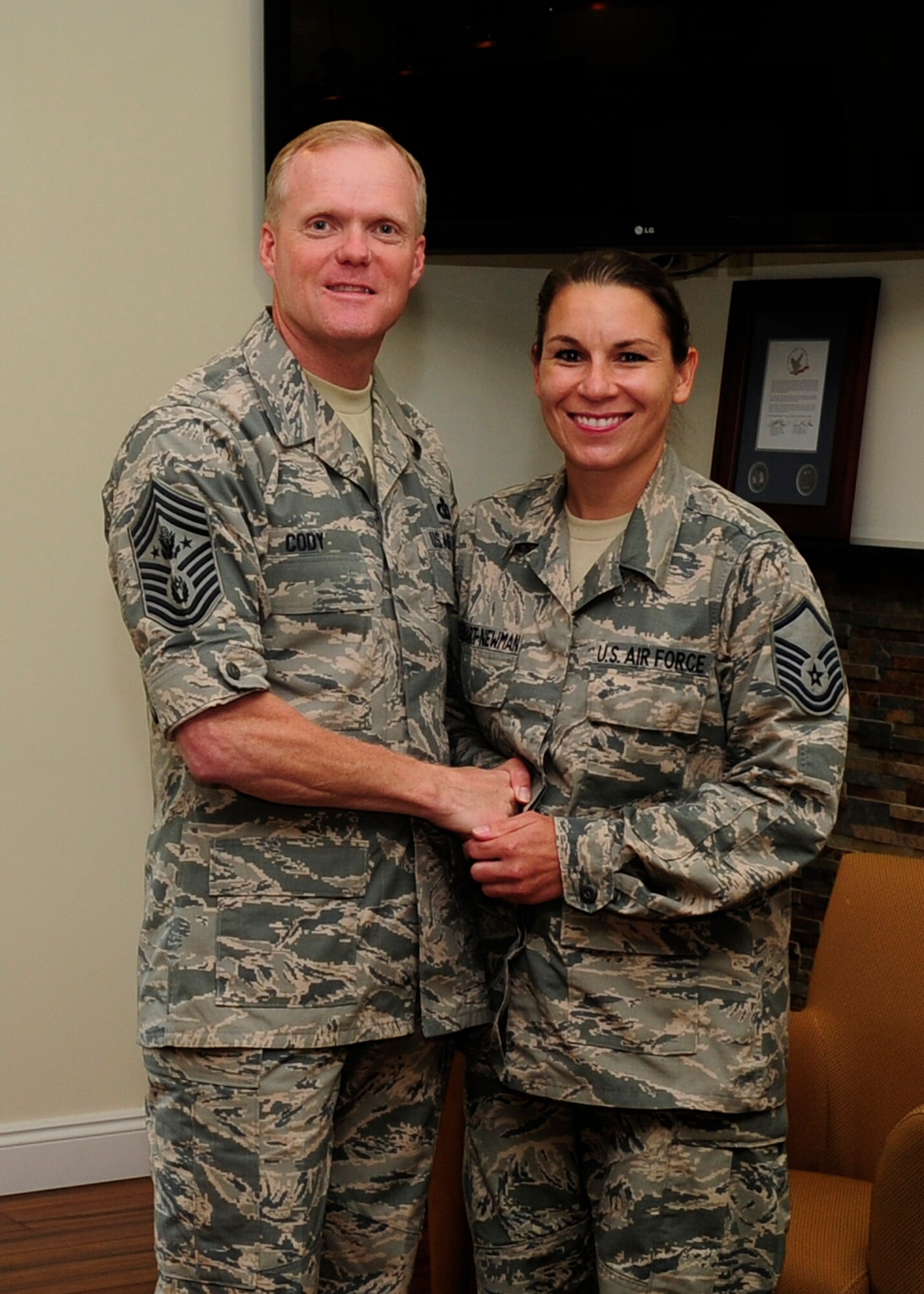 During a visit to Air Forces Northern Oct. 7, Chief Master Sergeant of the Air Force James Cody presented Master Sgt. Mickie Reinhart-Newman with his coin for exemplary duty performance. She is assigned to the AFNORTH’s National Emergency Preparedness Directorate but was most recently detailed to assist with administrative duties in AFNORTH’s command section. (Photo by Tech. Sgt. Javier Cruz Jr.)
