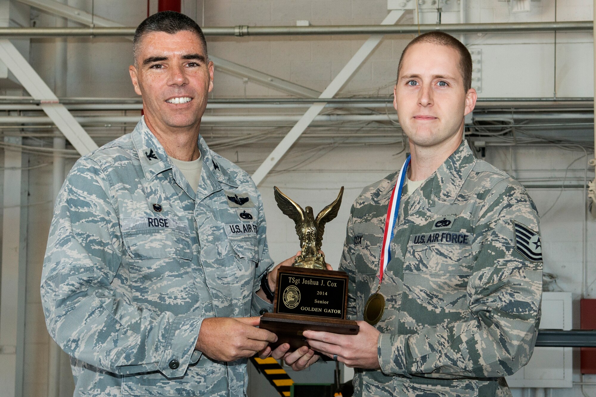 U.S. Air Force Tech. Sgt. Joshua Cox is selected to receive the Senior Golden Gator Award during the Gatorfest Awards Ceremony on Oct. 4, 2014, Barksdale Air Force Base, La. Cox is recognized as one of the 307th Bomb Wing's maintenance professionals of the year who has made the greatest contribution within his career field in the maintenance community. (U.S. Air Force photo by Master Sgt. Greg Steele/Released)