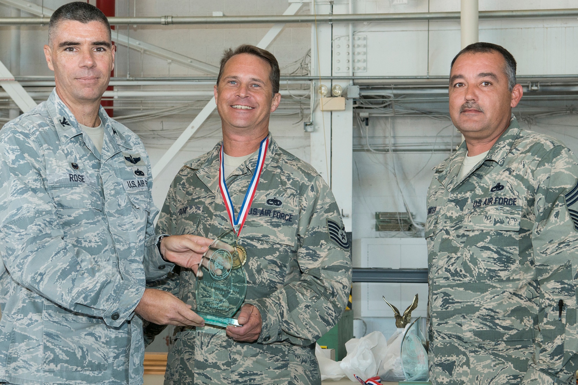 U.S. Air Force Tech. Sgt. Christopher Duhe, 307th Aircraft Maintenance Squadron crew chief, is awarded the Gatorfest Safety Award during a ceremony held on Oct. 4, 2014, Barksdale Air Force Base, La. Gatorfest is an annual event held to recognize outstanding Airmen who support the B-52 mission of the 307th Bomb Wing. (U.S. Air Force photo by Master Sgt. Greg Steele/Released)
