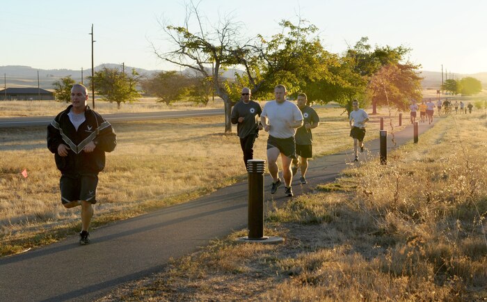 Members of Team Beale participate in a 5K run to observe Domestic Violence Awareness Month on Beale Air Force Base, Calif., Oct. 8, 2014. More than 200 runners participated in the event. (U.S. Air Force photo by Staff Sgt. Robert M. Trujillo/Released)