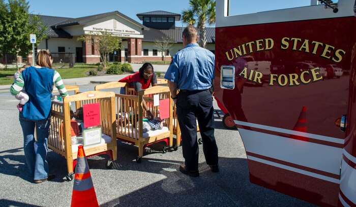 The Joint Base Charleston Fire Department visits the Brig. Gen. Thomas R. Mikolajcik Child Development Center, Oct. 6, 2014, on JB Charleston, S.C. Fire prevention Week was Oct. 5 through 11, and the JB Charleston Fire Department hosted several events around the Air Base and Weapons Station. Fire prevention week was established in 1925 by President Calvin Coolidge when he became aware that close to 15,000 American citizens had been killed in fires the previous year. (U.S. Air Force photo/Airman 1st Class Clayton Cupit)