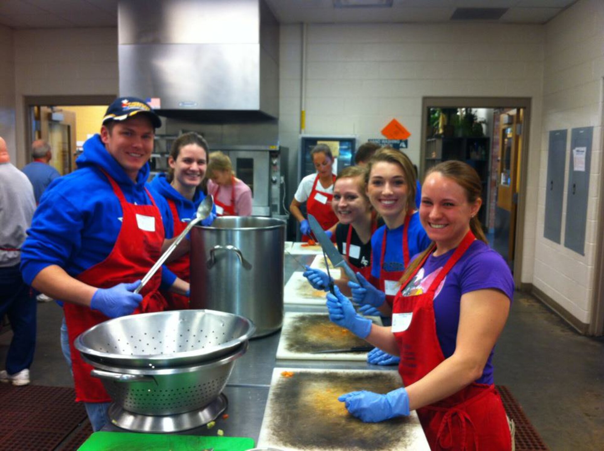U.S. Air Force Academy cadets work in the Marian House Soup Kitchen in downtown Colorado Springs Oct. 5, 2014. Cadet athletes regularly volunteer their time to serve meals to the kitchen's customers. (Courtesy photo)  