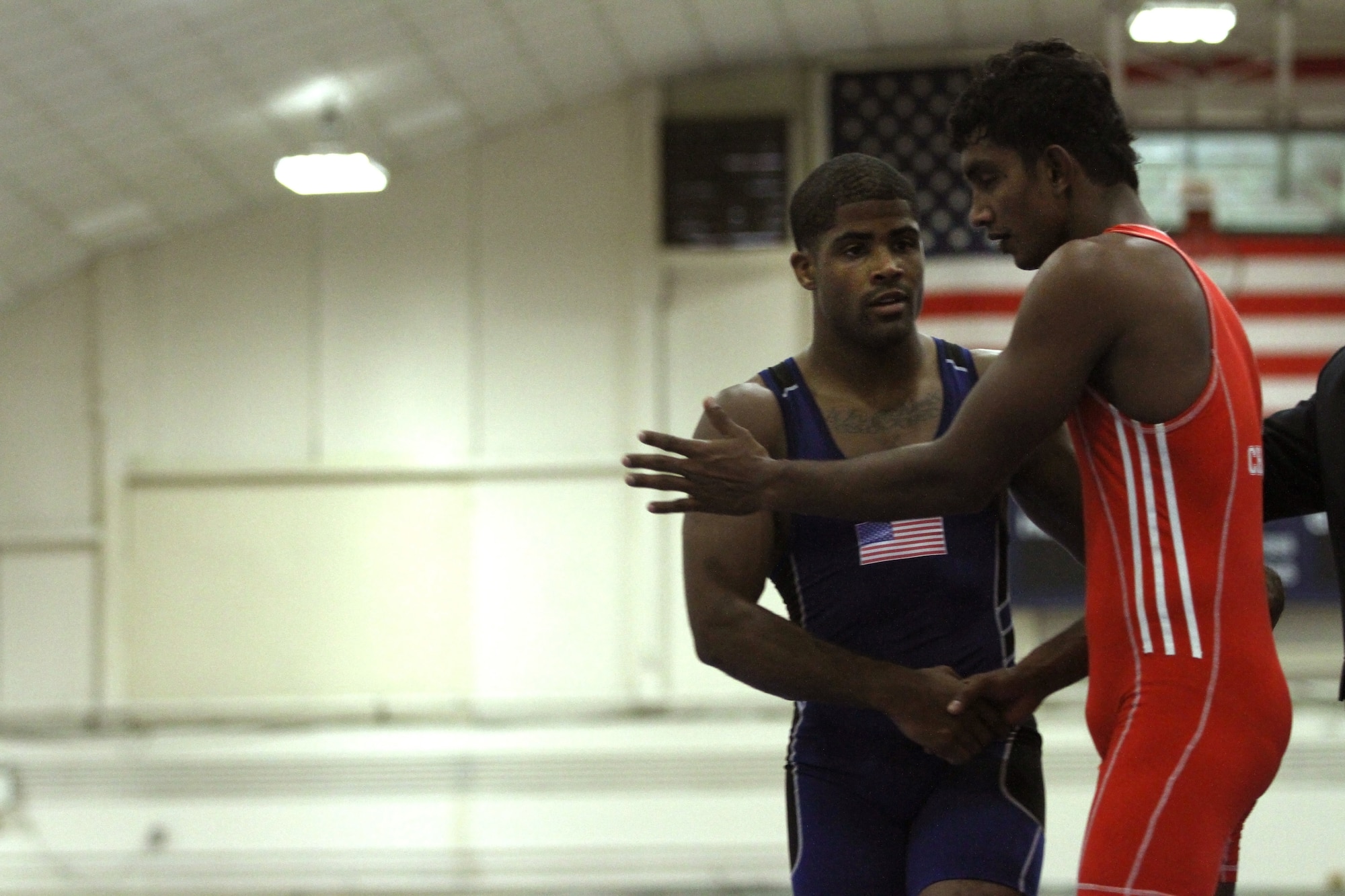 Army Sgt. Jamel Johnson, a unit supply specialist from Winston-Salem, N.C., shakes hands with Chamara Perera from Sri Lanka after defeating him 16-5 during the Military Sports Council World Military Wrestling Championships at Joint Base McGuire-Dix-Lakehurst, N.J., Oct. 3, 2014. Johnson placed fifth overall. (U.S. Army photo by Sgt. Adrian Borunda/Released)