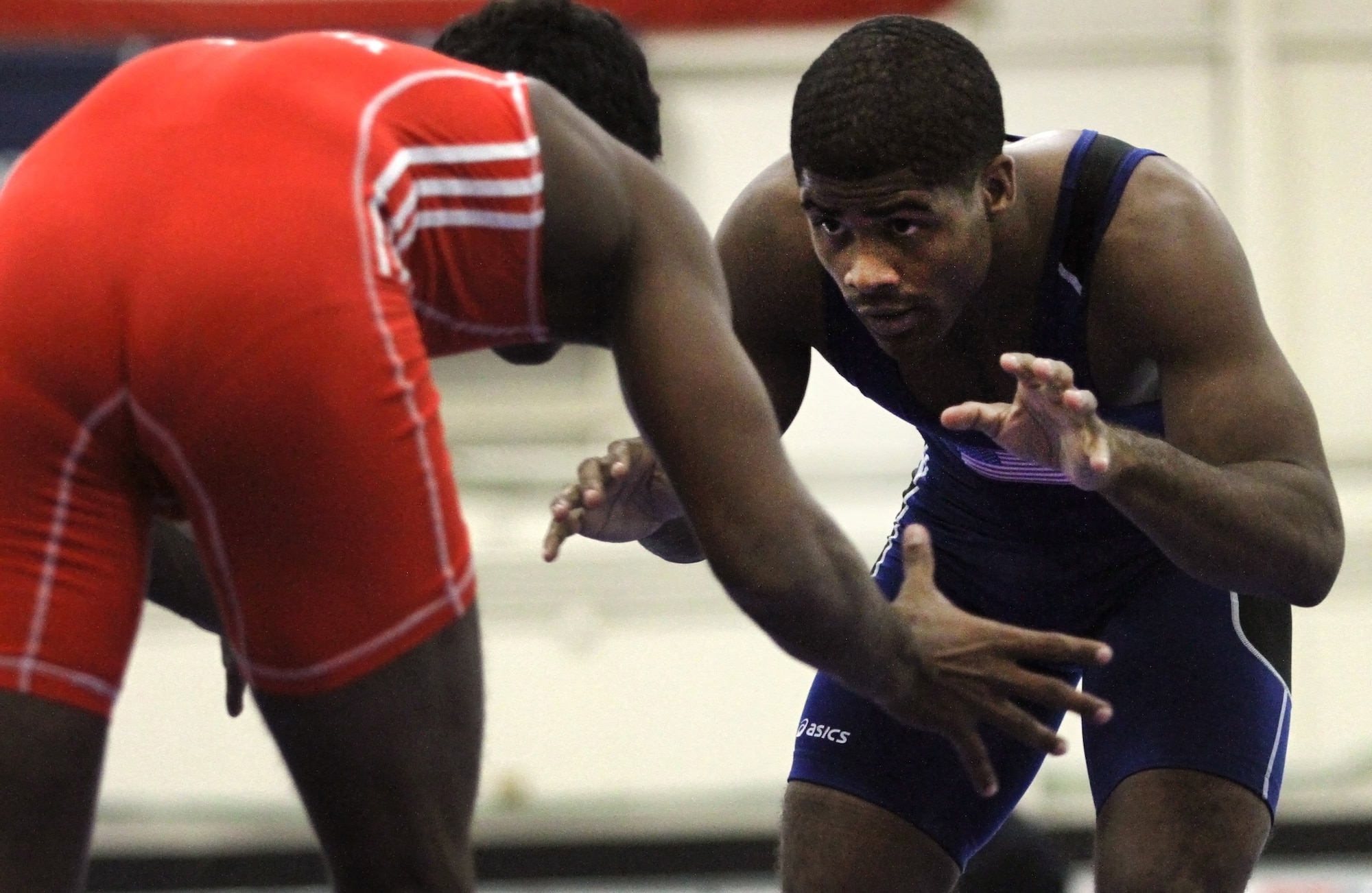 Army Sgt. Jamel Johnson, a unit supply specialist from Winston-Salem, N.C., stares down his opponent, Chamara Perera from Sri Lanka, during the Military Sports Council World Military Wrestling Championships Oct. 3, 2014. Johnson won the match 16-5. (U.S. Army photo by Sgt. Adrian Borunda/Released)