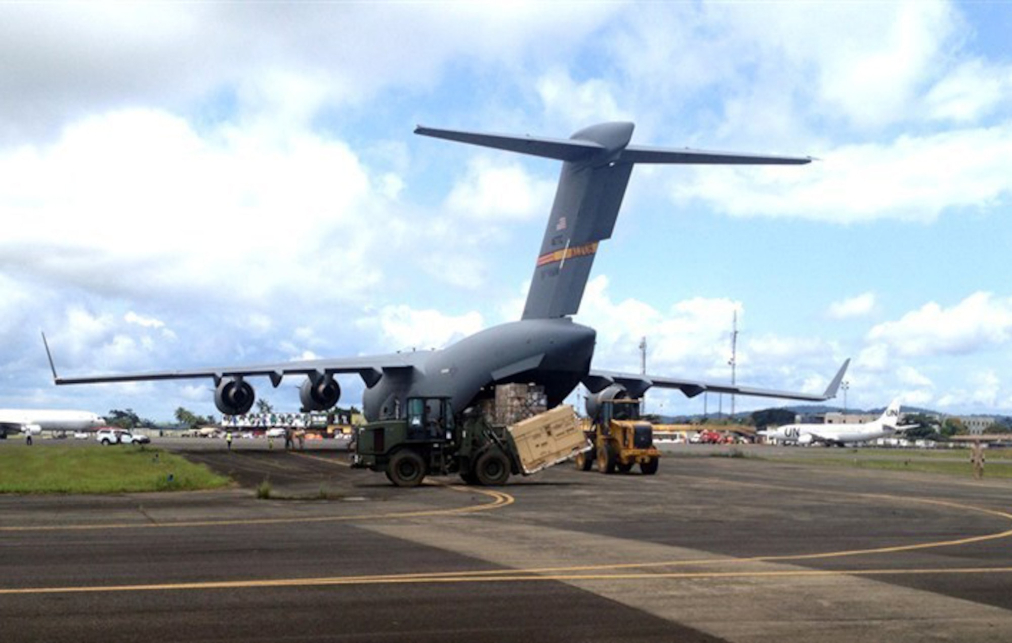 U.S. Airmen unload expeditionary medical support equipment from a 97th Air Mobility Wing C-17 Globemaster III cargo aircraft Sept. 30, 2014, in Monrovia, Liberia, in support of Operation United Assistance. United Assistance is a U.S. Africa Command-led operation to provide command and control, logistics, training and engineering support to the U.S. government's efforts to contain the Ebola virus outbreak in West African nations. (U.S. Army photo/Released)
