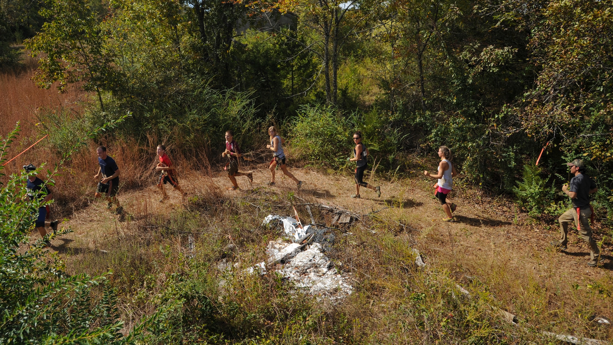 A group of participants run toward their next obstacle during the Zombie Resistance Run Oct. 4, 2014, at Little Rock Air Force Base, Ark. The event had approximetely 90 volunteers and more than 200 participants.  (U.S. Air Force photo by Airman 1st Class Harry Brexel) 