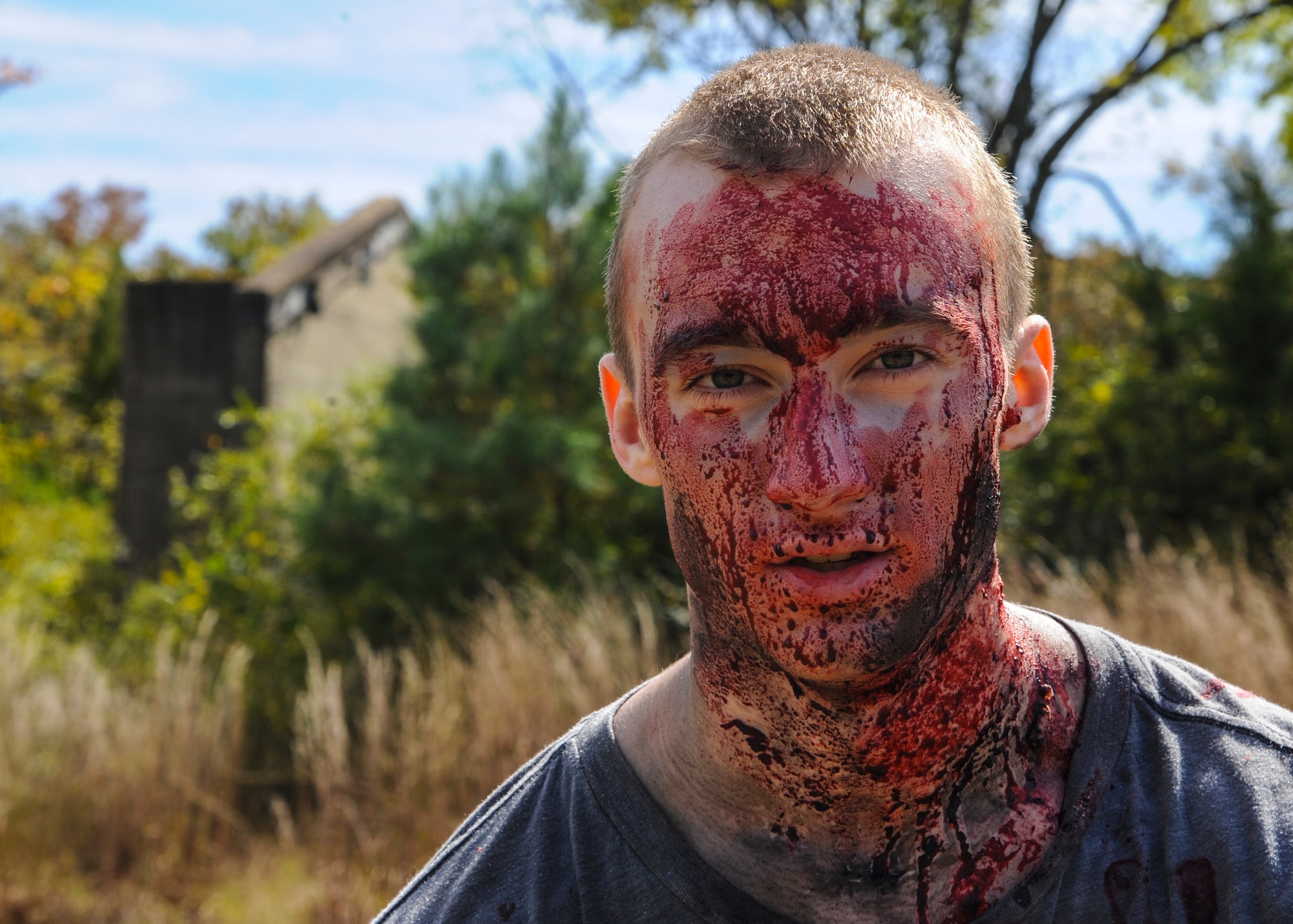 Airman 1st Class Killian Hudgins, a 19th Operations Support Squadron air traffic controller, displays his zombie ensemble as a volunteer during the Zombie Resistance Run Oct. 4, 2014, at Little Rock Air Force Base, Ark. More than 90 Airmen volunteered to help make the event a success. (U.S. Air Force photo by Airman 1st Class Harry Brexel)