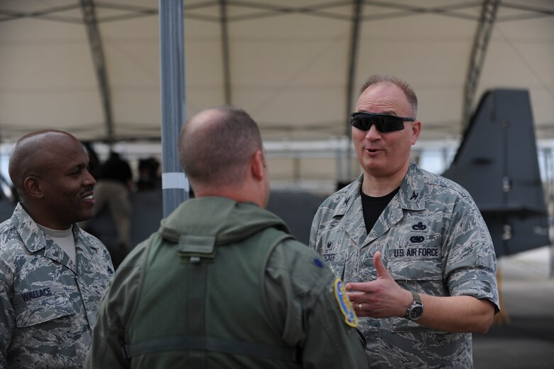 U.S. Air Force Col. Jeffrey Decker, 23d Maintenance Group commander, talks with Lt. Col. Jeffrey Hogan and Senior Master Sgt. Dexter Wallace on the flightline Sept. 26, 2014, at Moody Air Force Base, Ga. As the MXG commander, Decker is responsible for all organizational and intermediate level maintenance for Air Combat Command's largest maintenance organization.  (U.S. Air Force photo by Andrea Jenkins)
