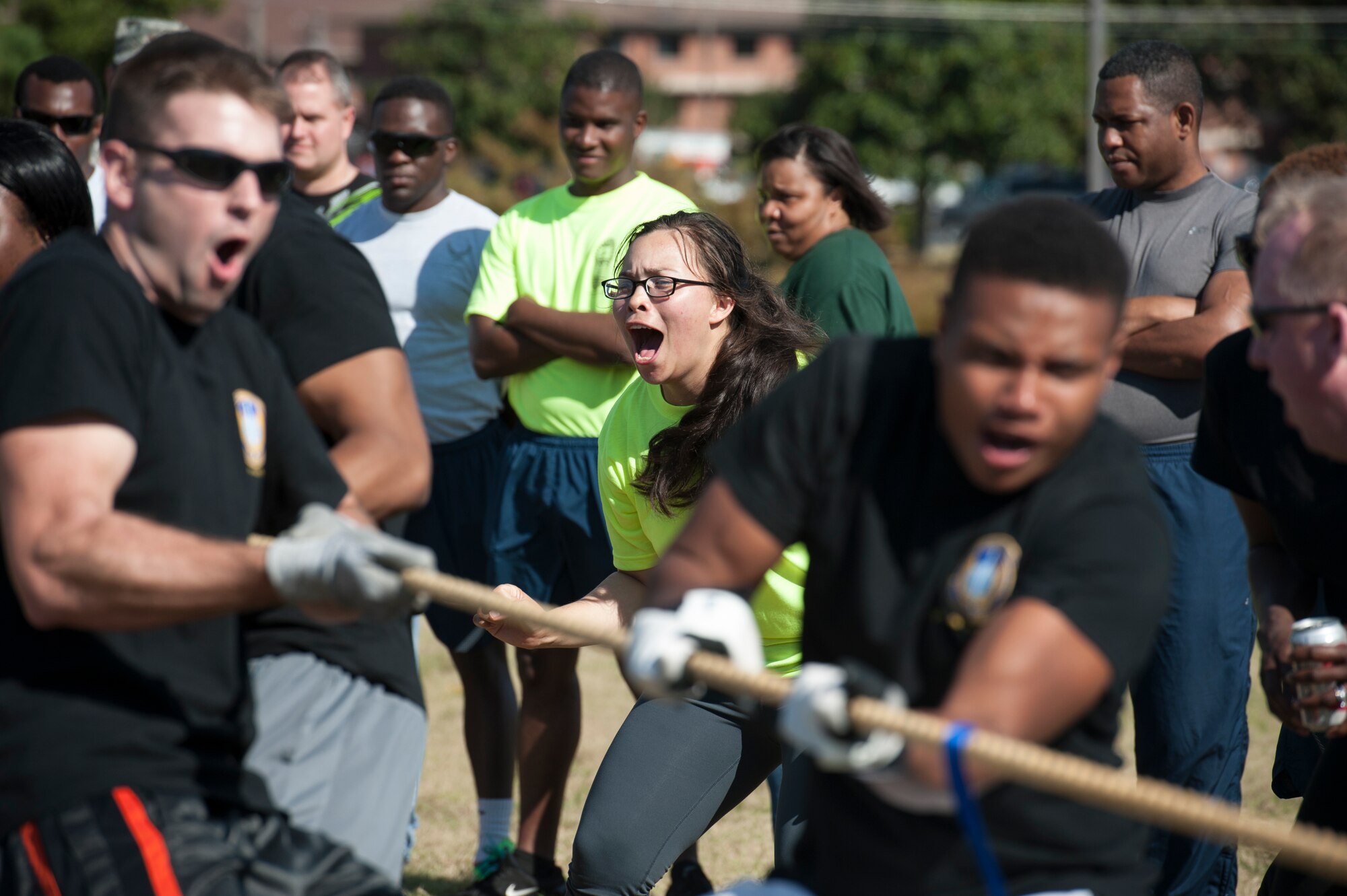 1st Lt. Rachael Jarrell, 19th Logistics Readiness Squadron officer in charge of vehicle operations, cheers for her team during the tug-of-war competition Oct. 3, 2014, at Little Rock Air Force Base, Ark. The 61st Airlift Squadron ultimately won to the tug-of-war competition and was recognized as the overall Sports Day champions. (U.S. Air Force photo by Airman 1st Class Scott Poe)