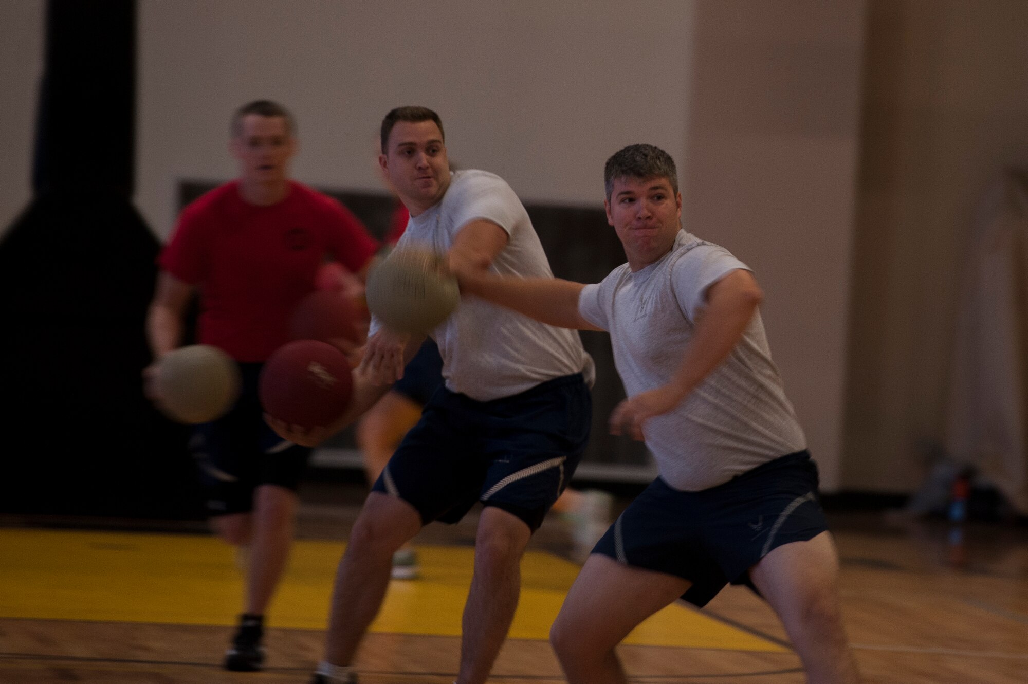 Members of the 50th Airlift Squadron throw dodge balls at their opponents during Sports Day Oct. 3, 2014, at Little Rock Air Force Base, Ark. The 19th Contracting Squadron was awarded first place for the dodge ball tournament.  (U.S. Air Force photo by Senior Airman Kaylee Clark)