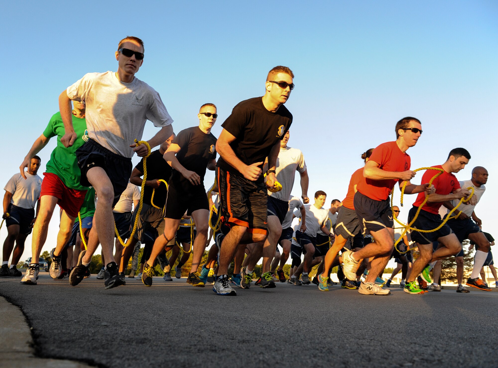 Participants in the 19th Airlift Wing Sports Day take off during the tandem run Oct. 3, 2014, at Little Rock Air Force Base, Ark. The tandem run was one of 17 events Team Little Rock members could participate in during Sports Day, and first place was awarded to the 19th Logistics Readiness Squadron. (U.S. Air Force photo by Staff Sgt. Jessica Condit)