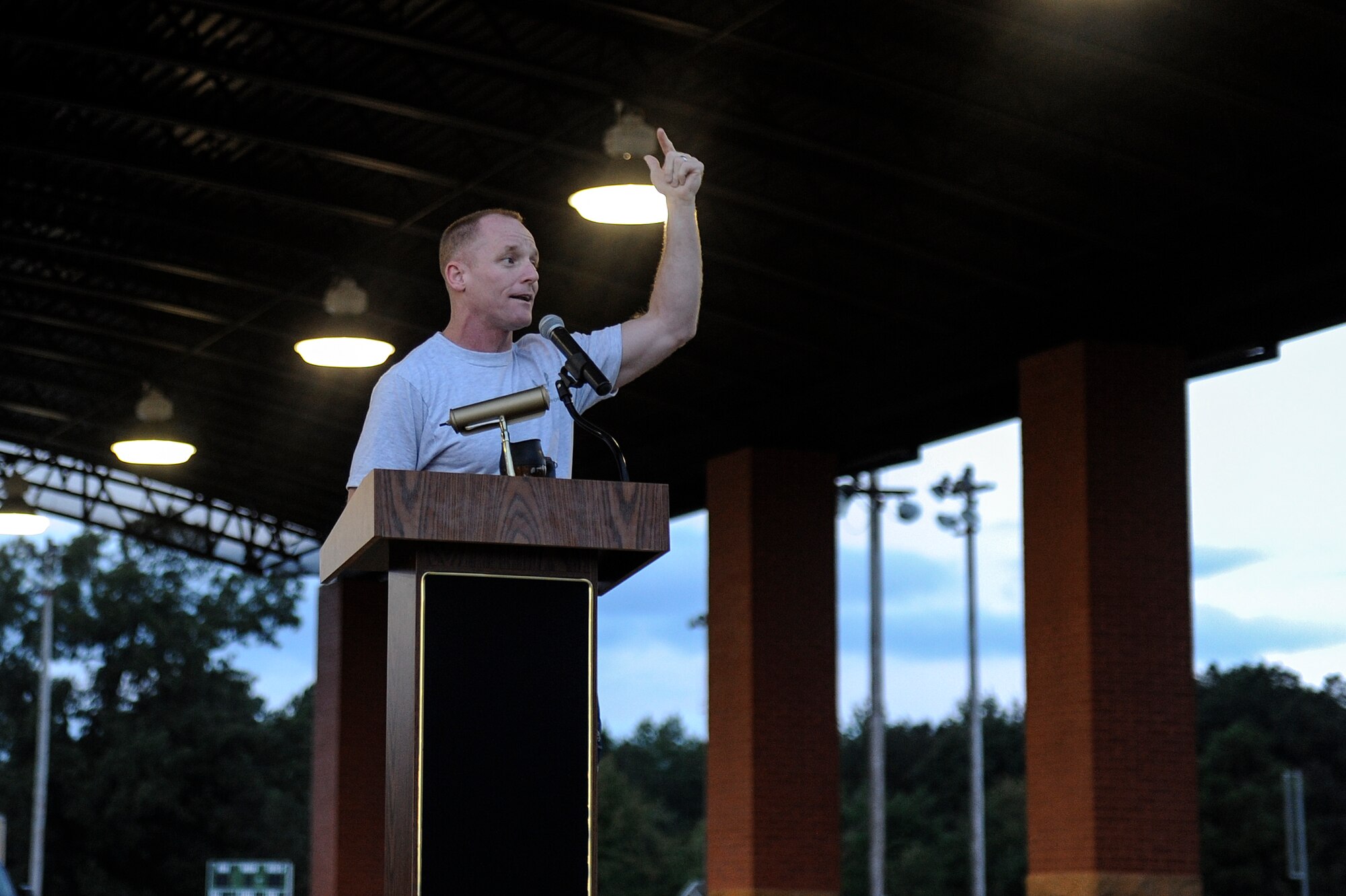 Col. Patrick Rhatigan, 19th Airlift Wing commander, gives a motivational speech before the kick-off of Sports Day Oct. 3, 2014, at Little Rock Air Force Base, Ark. Sports Day consisted of 17 events with participation from units and organizations across the installation. (U.S. Air Force photo by Staff Sgt. Jessica Condit)