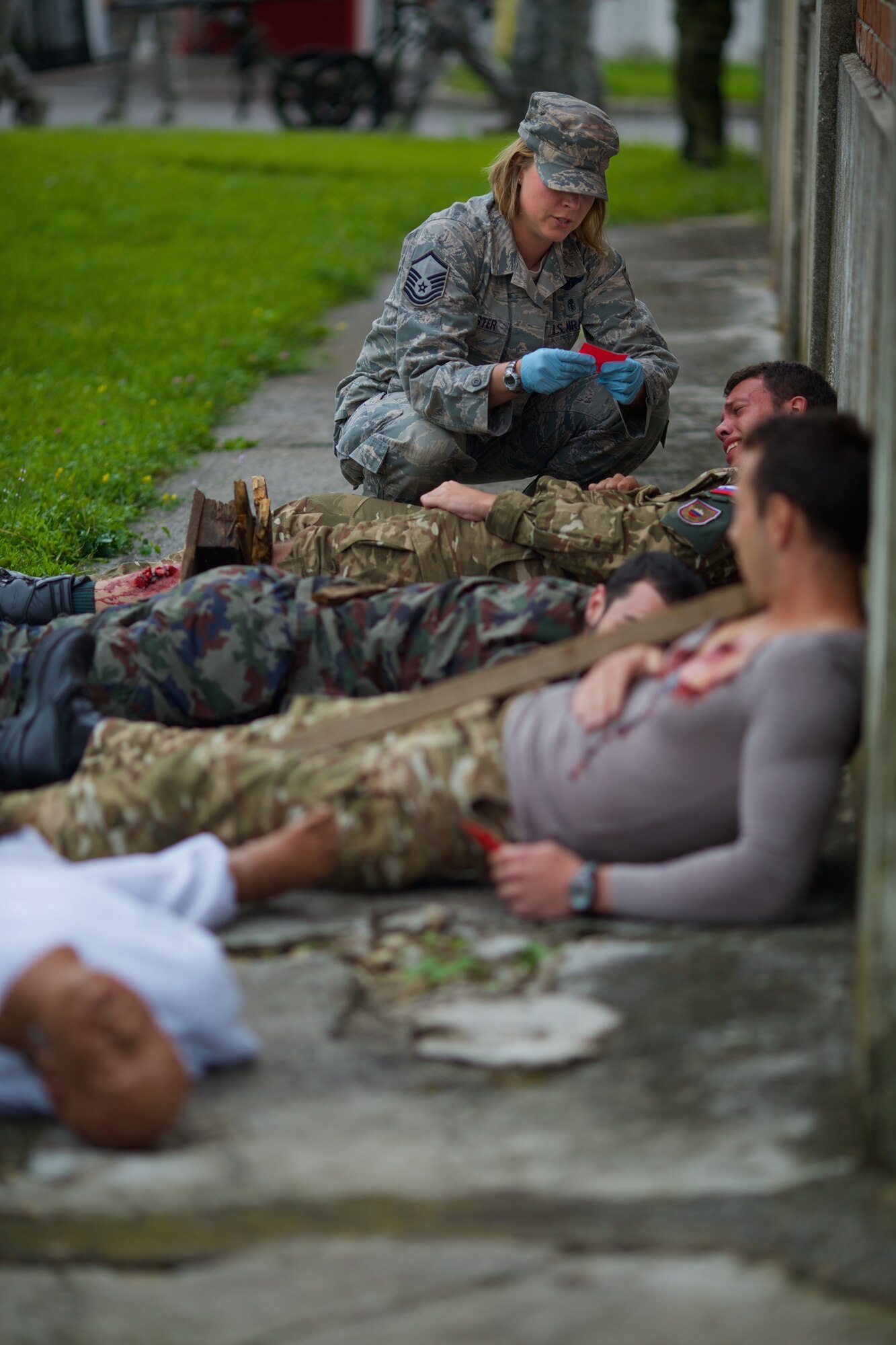 A member of the 48th Fighter Wing Medical Group triages patients from a mock explosion during Exercise Immediate Response in Slovenia. Exercises like Immediate Response give partner nations the opportunity to learn to train and work together. (U.S. Air Force Photo by Maj. Joshua Young/Released)