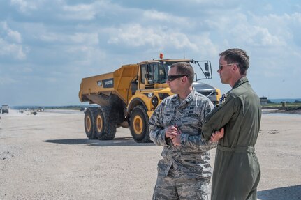 Capt. Erich Kramer, 820th Rapid Engineers Deployable Heavy Operational Repair Squadron Engineers design engineer, and Lt. Col. Matthew Borgos, 560th Flying Training Squadron instructor pilot, view construction progress Sept. 30, 2014, at the Seguin Auxiliary Air Field, Texas. More than 73,000 tons of gravel have been used to lay the base course of the runway. (U.S. Air Force photo by Airman 1st Class Stormy Archer/Released)