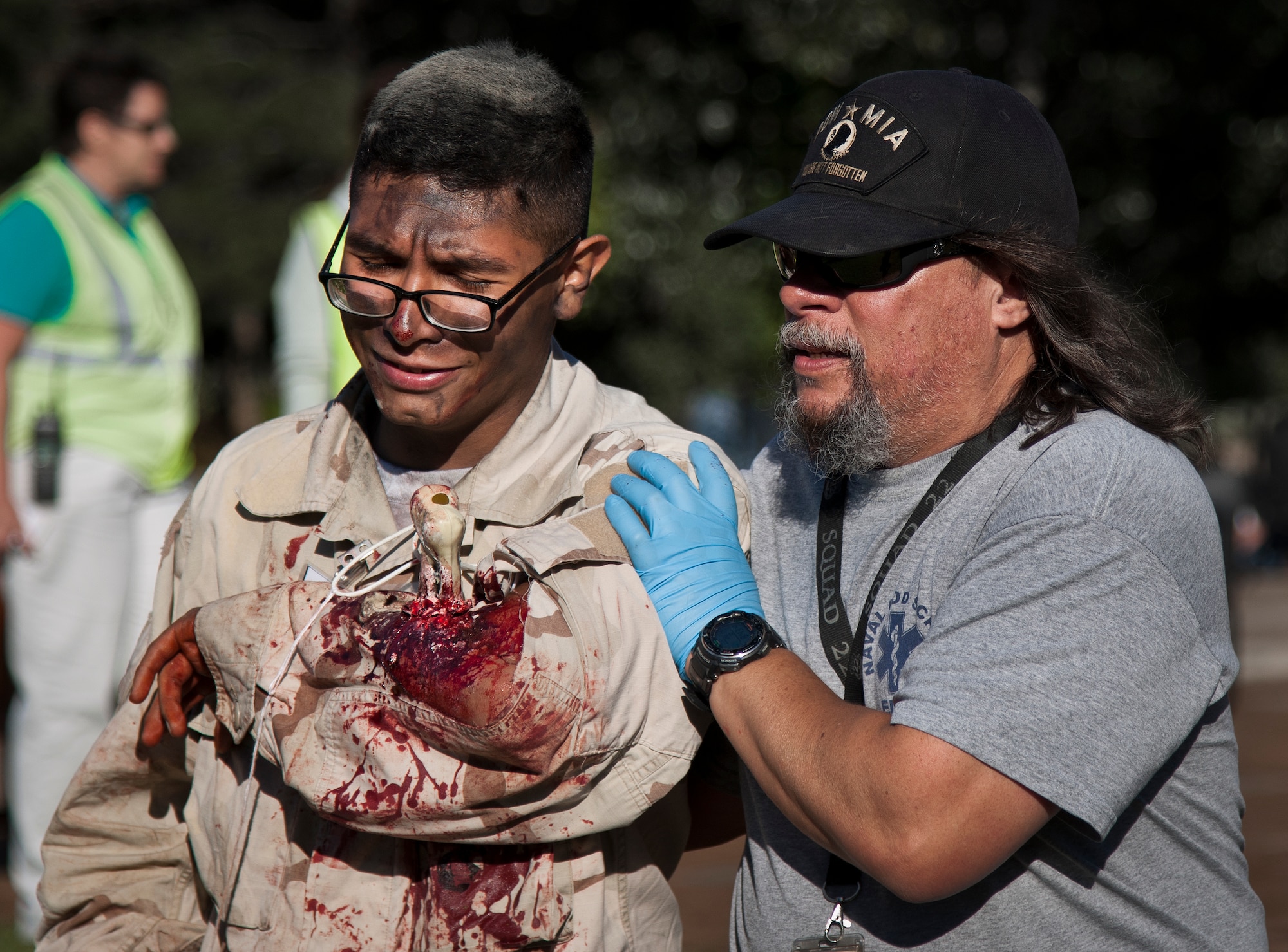 A Navy School Explosive Ordnance Disposal medic moves a simulated victim to a triage area during a major accident response exercise Oct. 7 at Eglin Air Force Base, Fla.  The exercise scenario was a simulated vehicle-borne improvised explosive device was detonated at the EOD school house killing and injuring students. The exercise helped train Navy EOD School staff, Team Eglin first responders and local emergency crews.  Firefighters and emergency medical technicians responded to the scene to put out the fire and assist the victims.  (U.S. Air Force photo/Samuel King Jr.)