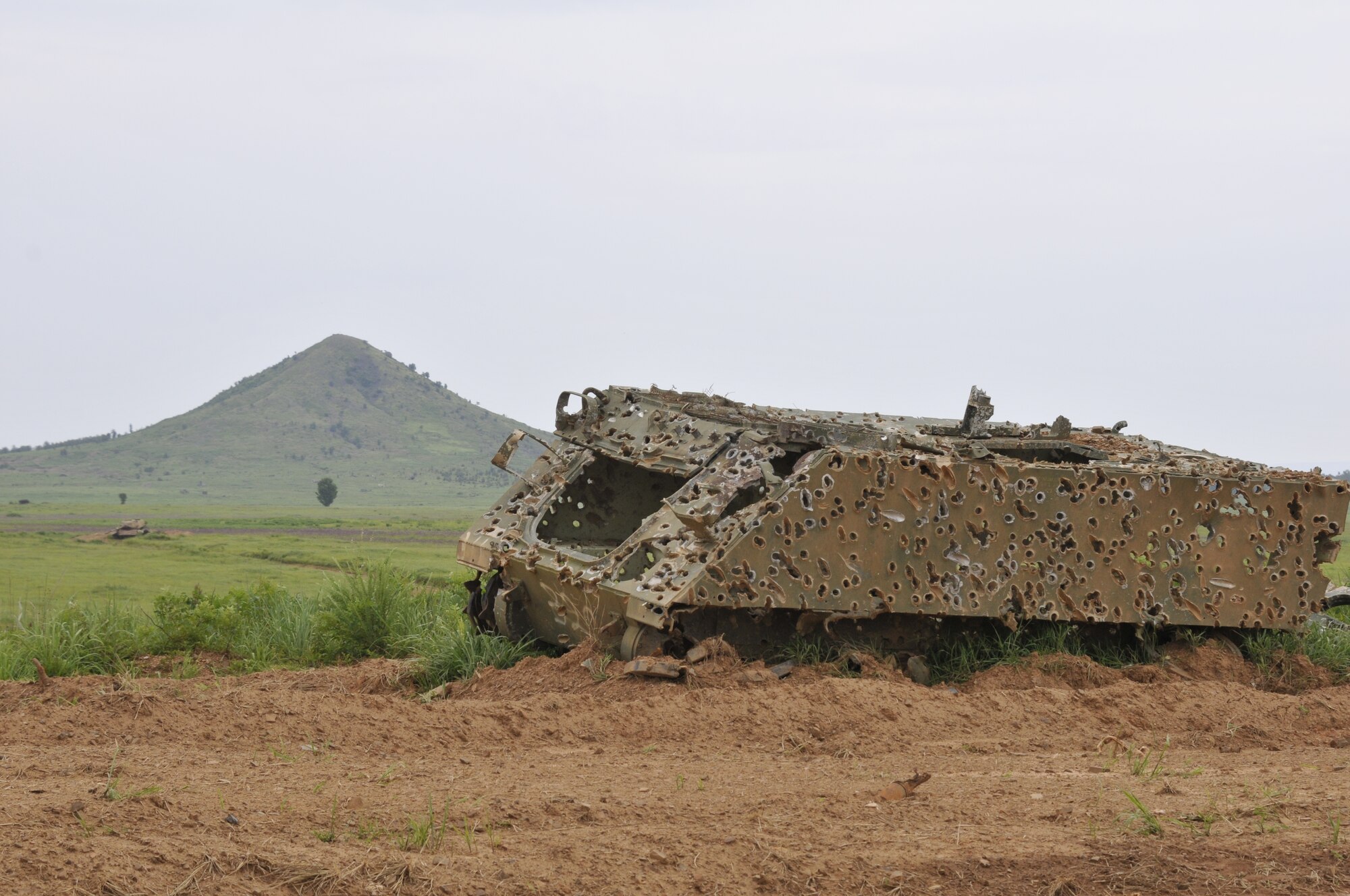 A US M-113 Armored Personnel Carrier sits with Potato Hill in the background at 188th Wing Detachment 1 Razorback Range at Fort Chaffee Maneuver Training Center, Arkansas, July 14, 2014. The range is maintained by the 188th and provides varying types of training to military units from around the world. (U.S. Air National Guard photo by Staff Sgt. John Suleski/released)